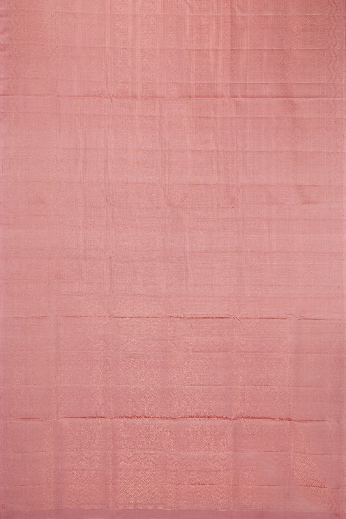 Flat view of Rose Gold Soft Silk Saree with Zari Brocade on the body and Fancy Border. 