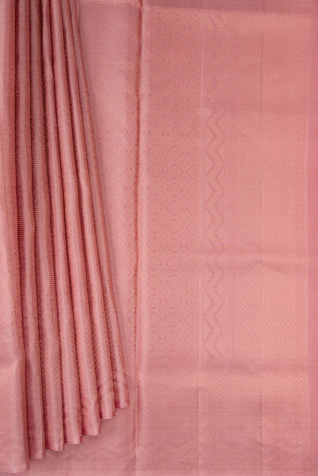 Pleats and pallu of Rose Gold Soft Silk Saree with Zari Brocade on the body and Fancy Border. 