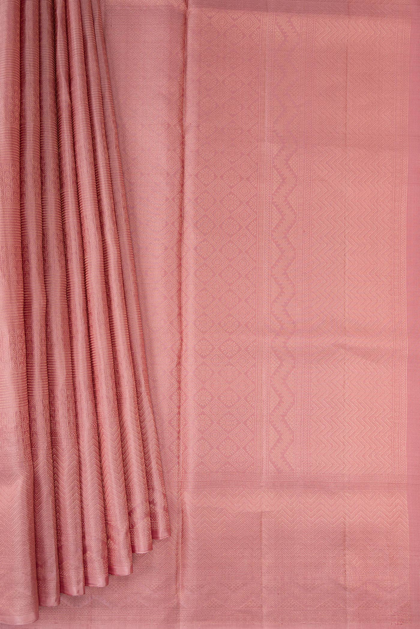 Pleats and pallu of Rose Gold Soft Silk Saree with Zari Brocade on the body and Fancy Border. 