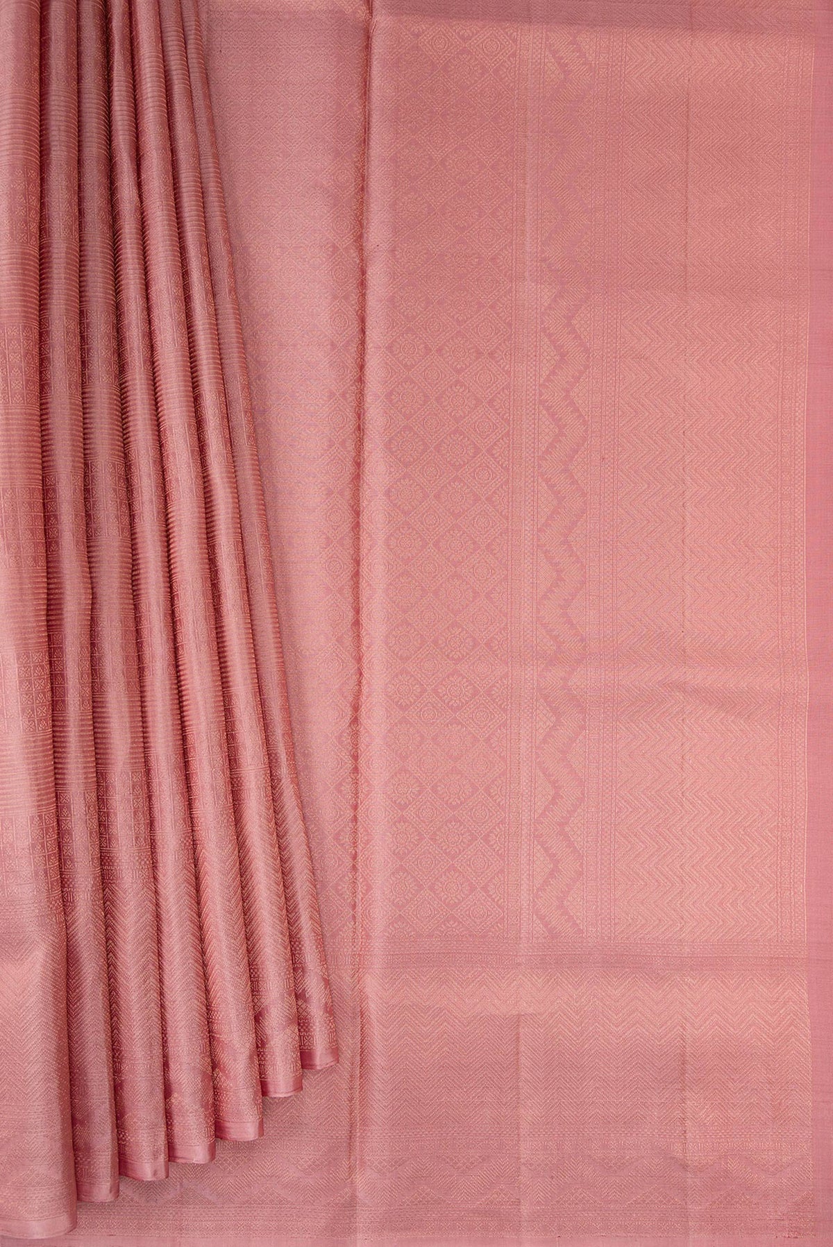 Pleats and pallu of Rose Gold Soft Silk Saree with Zari Brocade on the body and Fancy Border. 