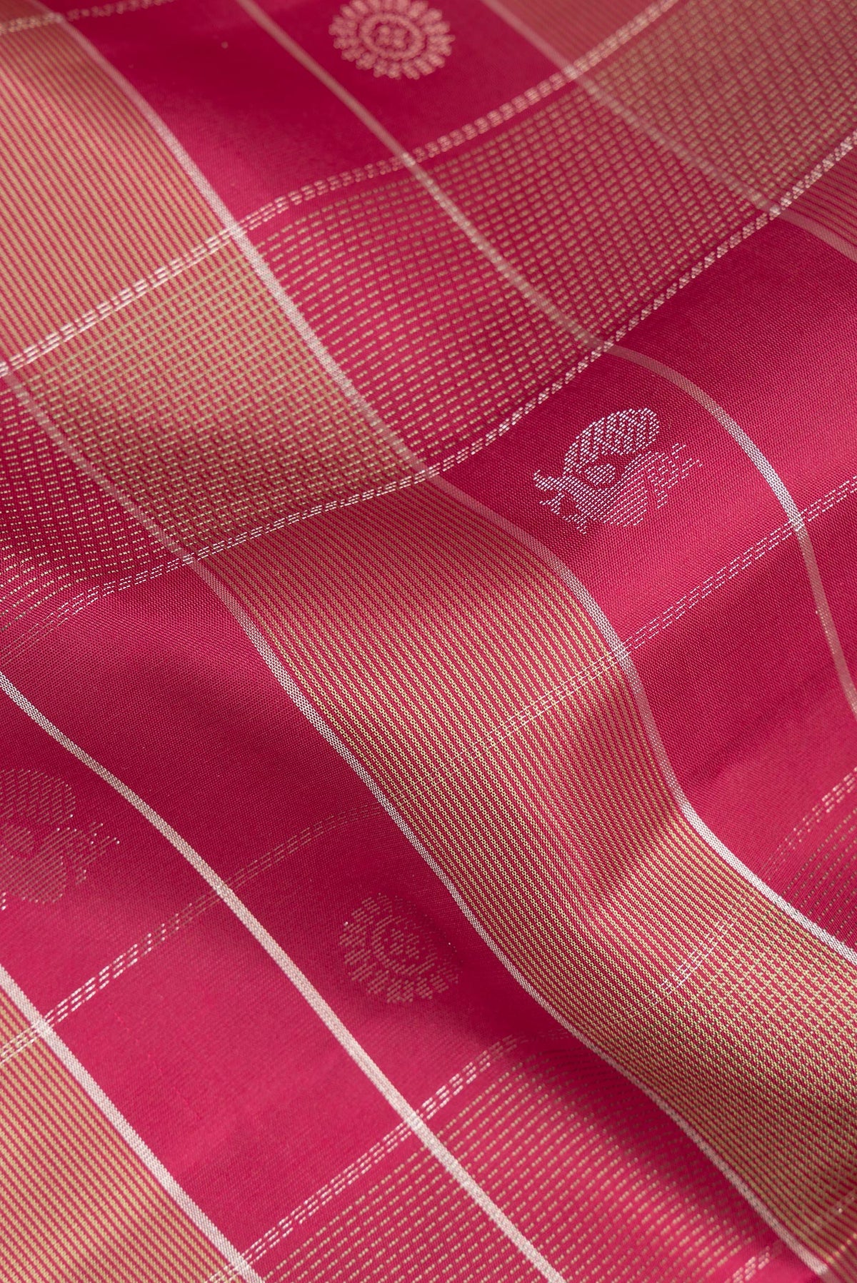 Close up of Pure Silk Maroon Dual Tone Soft Saree with Checked design on the body and Zari Border.  displaying folds