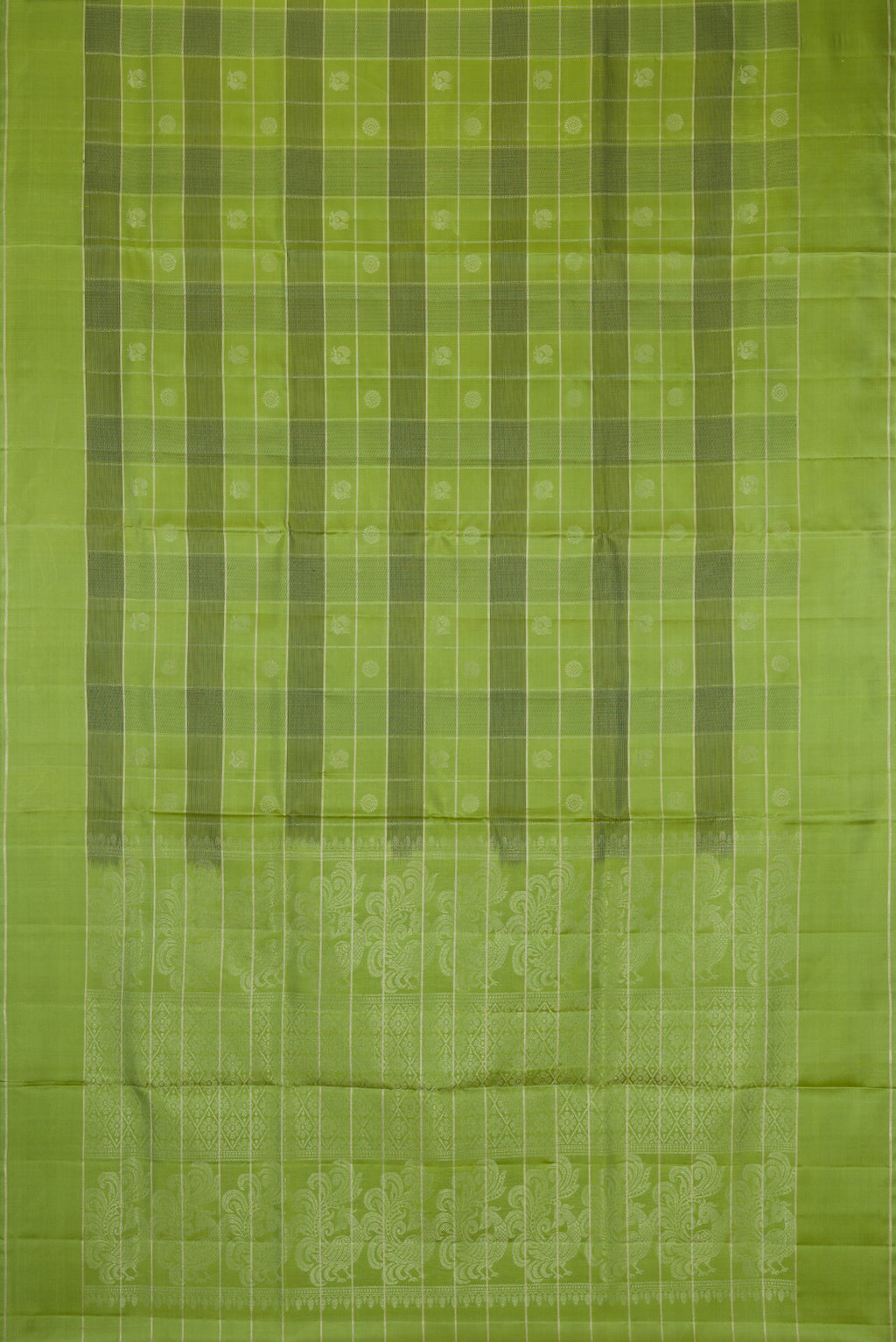 Flat view of Green Soft Silk Saree with Checked design on the body and Plain Border. 