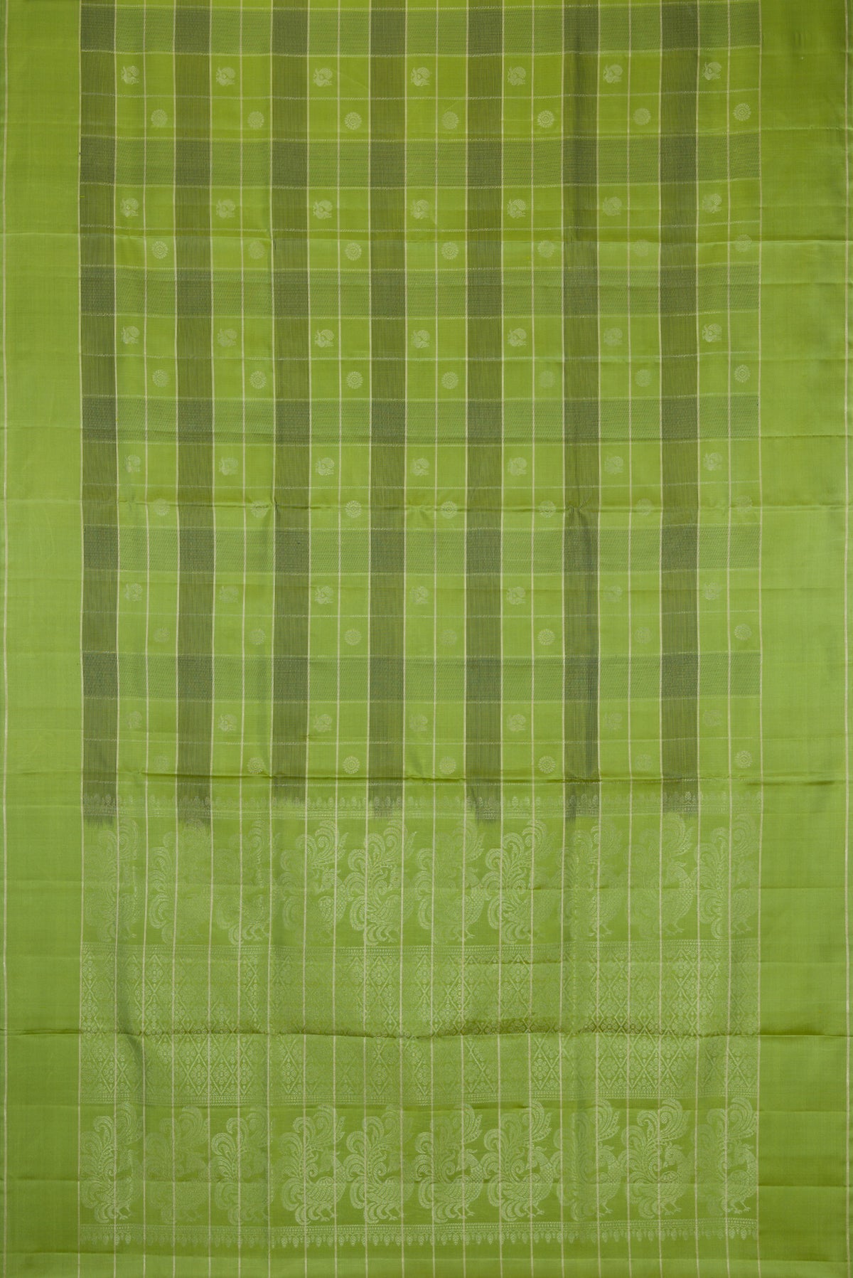 Flat view of Green Soft Silk Saree with Checked design on the body and Plain Border. 
