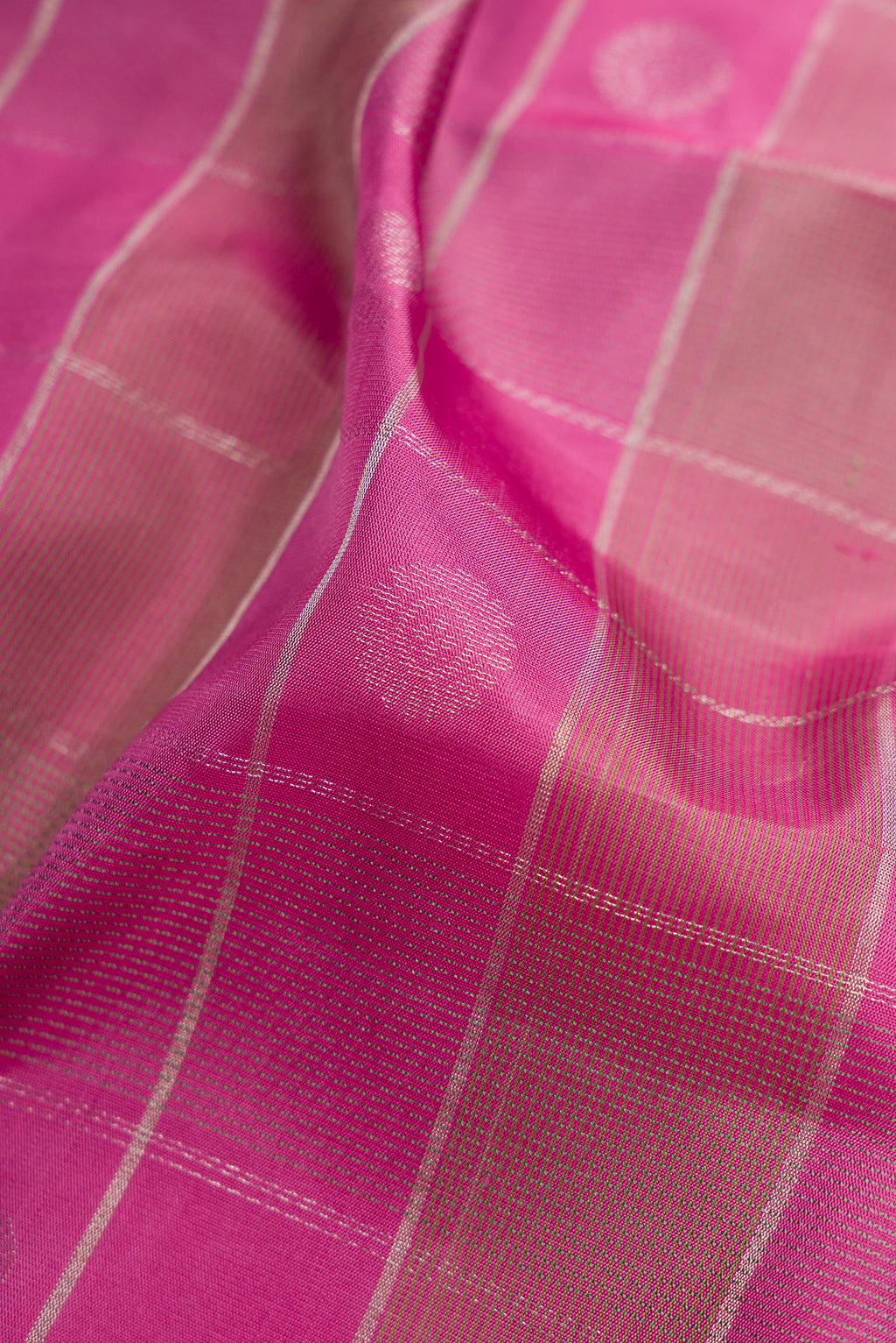 Close up of Pink Soft Silk Saree with Checked design on the body and Plain Border.  displaying folds