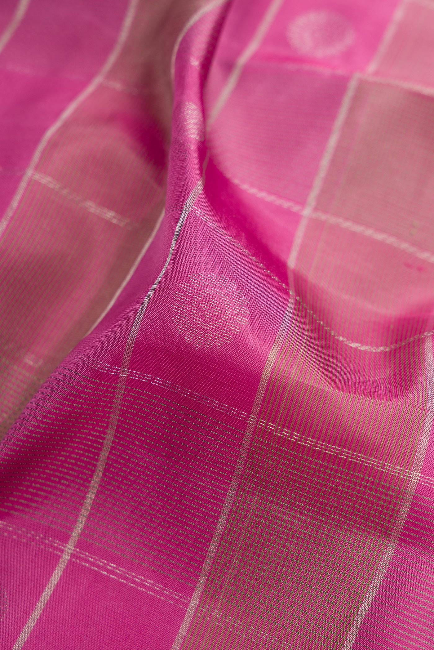 Close up of Pink Soft Silk Saree with Checked design on the body and Plain Border.  displaying folds