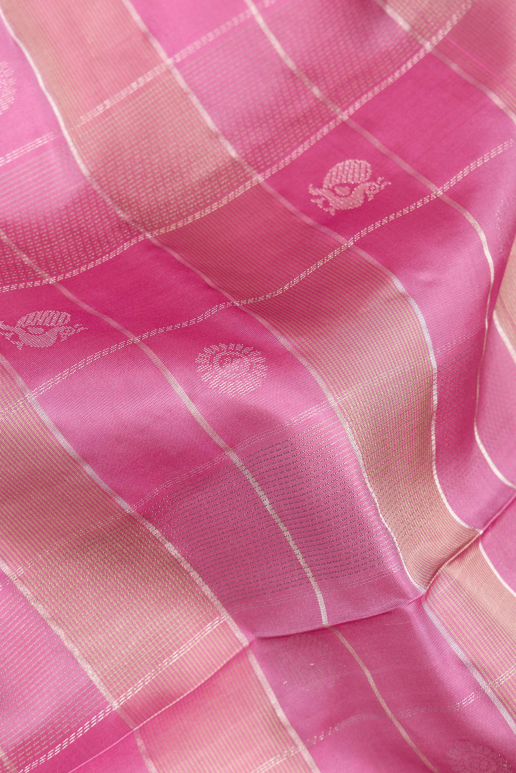 Close up of Pure Silk Pink Dual Tone Soft Saree with Checked design on the body and Zari Border.  displaying folds