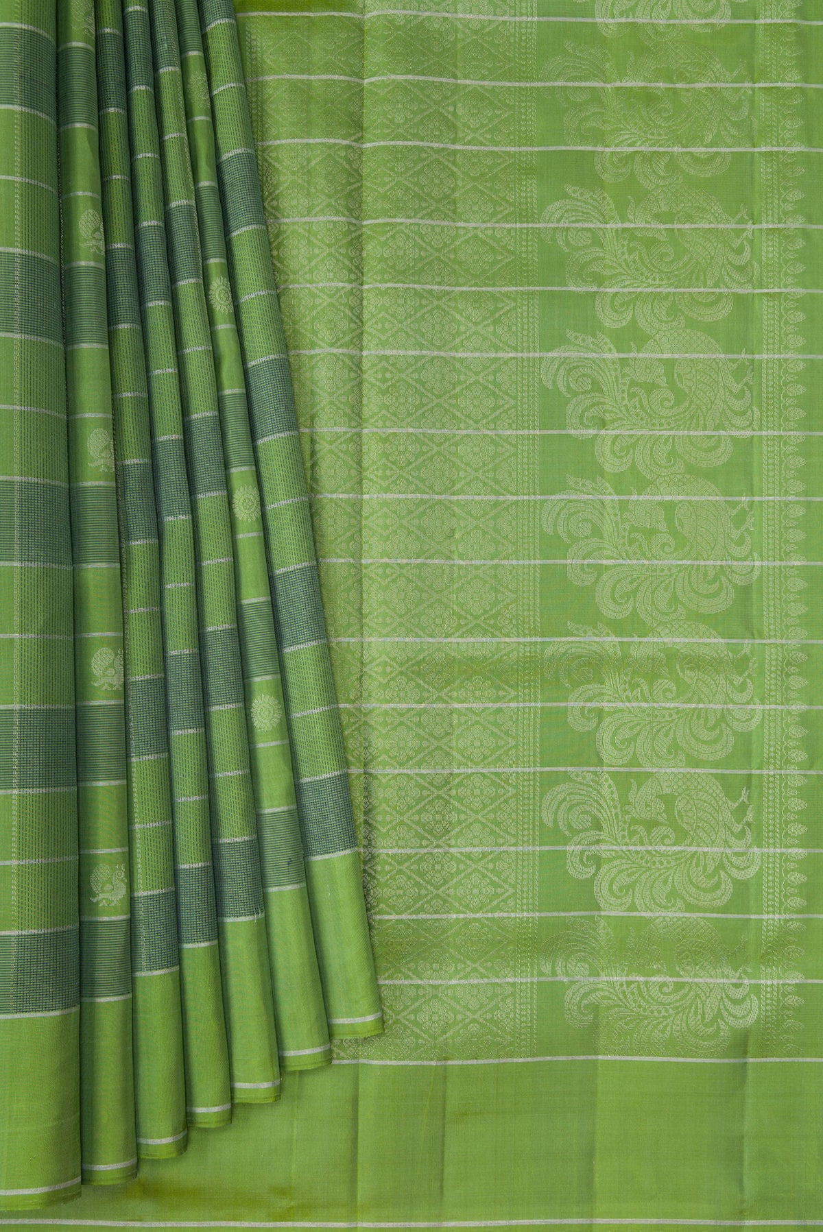 Pleats and pallu of Green Soft Silk Saree with Checked design on the body and Plain Border. 