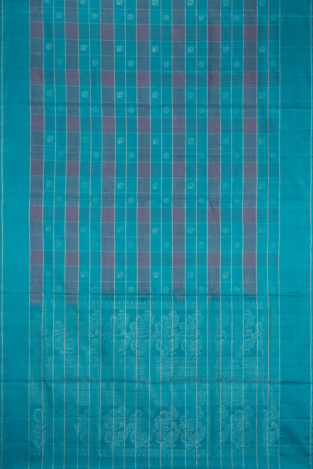 Flat view of Sky Blue Soft Silk Saree with Checked design on the body and Plain Border. 