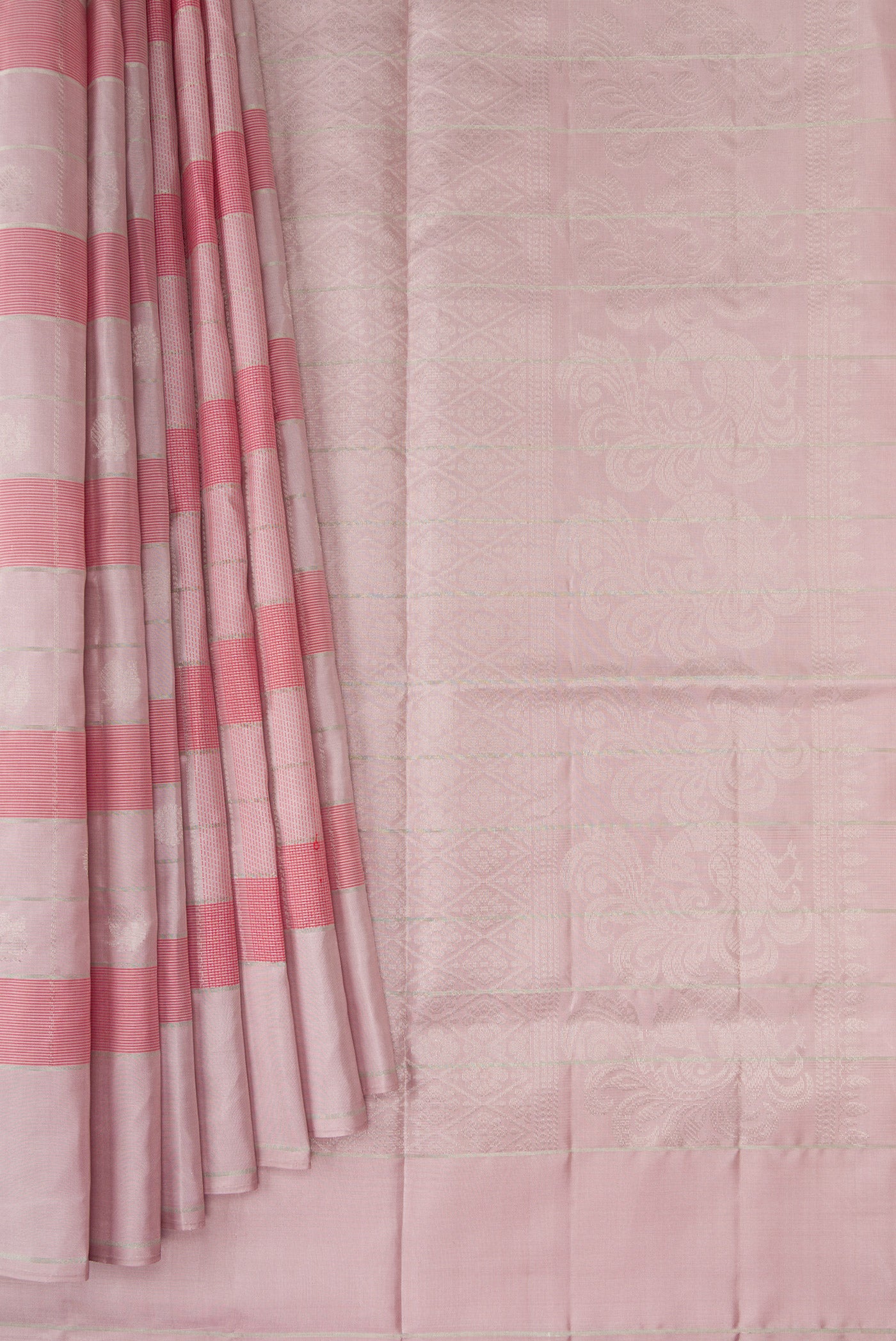 Pleats and pallu of Rose Gold Soft Silk Saree with Checked design on the body and Plain Border. 
