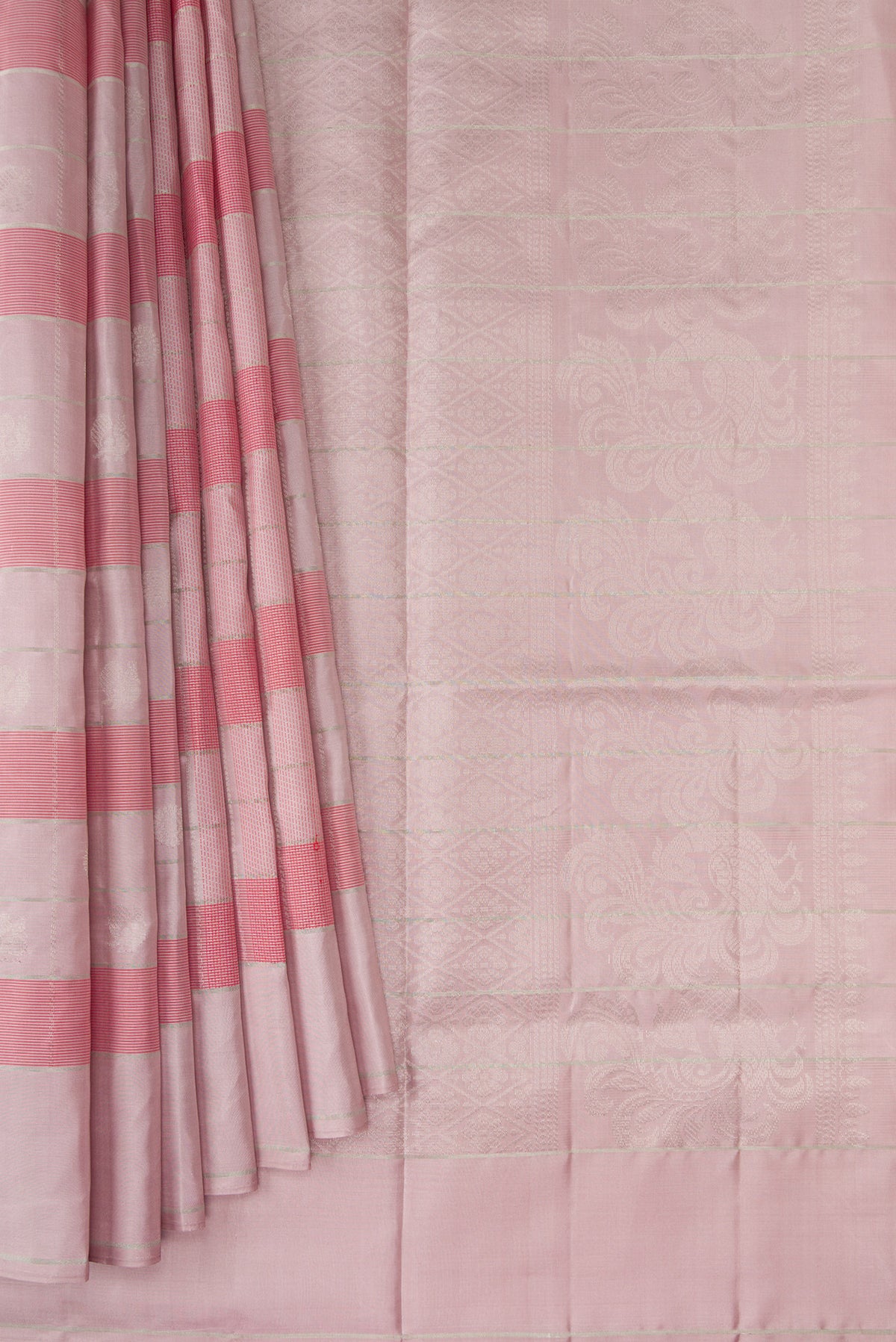 Pleats and pallu of Rose Gold Soft Silk Saree with Checked design on the body and Plain Border. 
