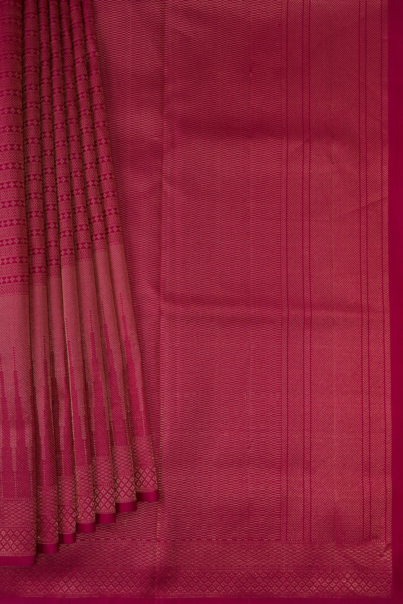 Pleats and pallu of Maroon Soft Silk Saree with Zari Brocade on the body and Fancy Border. 