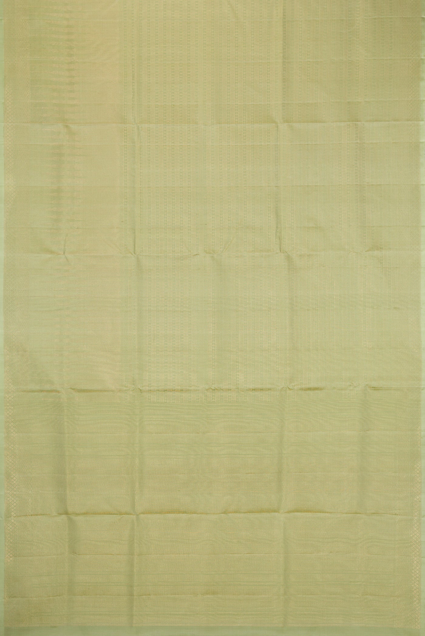 Flat view of Pista Green Soft Silk Saree with Zari Brocade on the body and Fancy Border. 