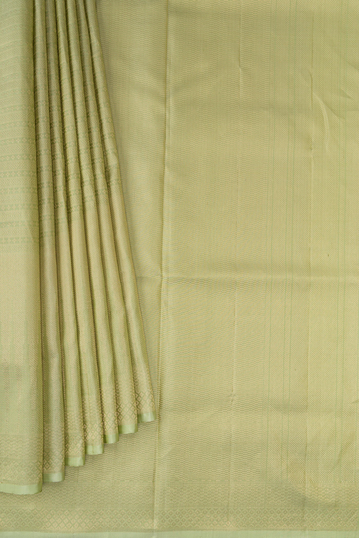 Pleats and pallu of Pista Green Soft Silk Saree with Zari Brocade on the body and Fancy Border. 