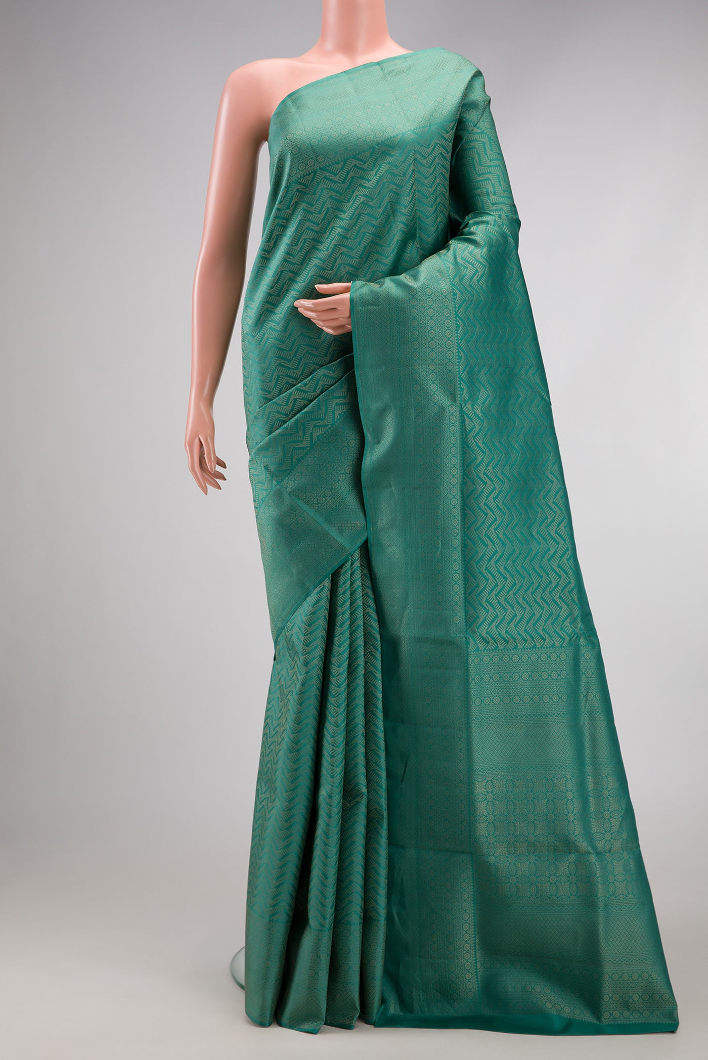 Maya Blue Soft Silk Saree with Zari Brocade on the body and Fancy Border.  displayed on a mannequin