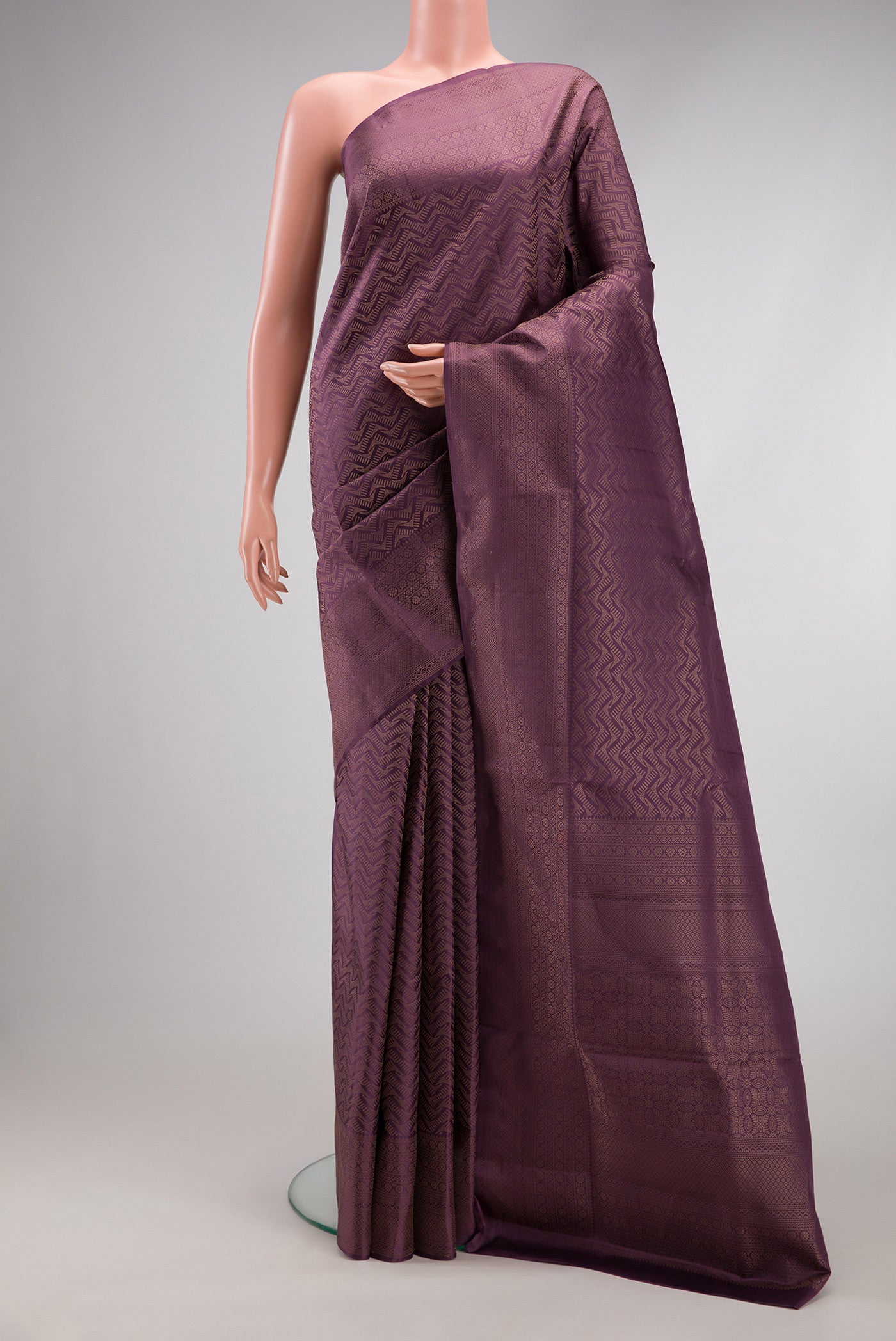 Purple Soft Silk Saree with Zari Brocade on the body and Fancy Border.  displayed on a mannequin