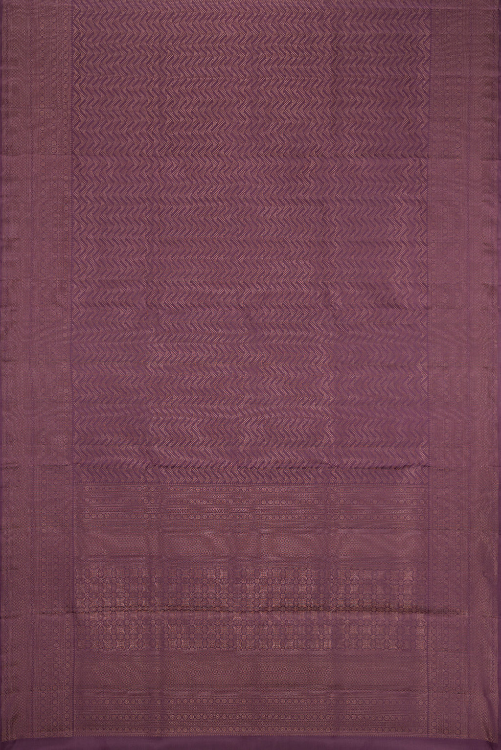 Flat view of Purple Soft Silk Saree with Zari Brocade on the body and Fancy Border. 