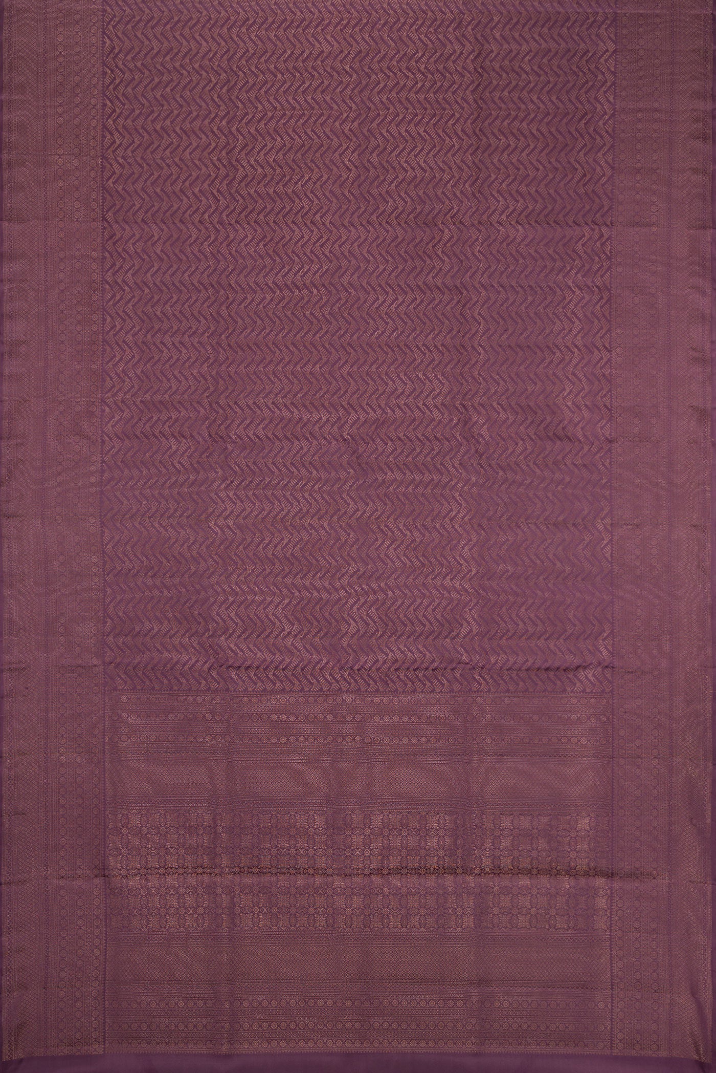 Flat view of Purple Soft Silk Saree with Zari Brocade on the body and Fancy Border. 