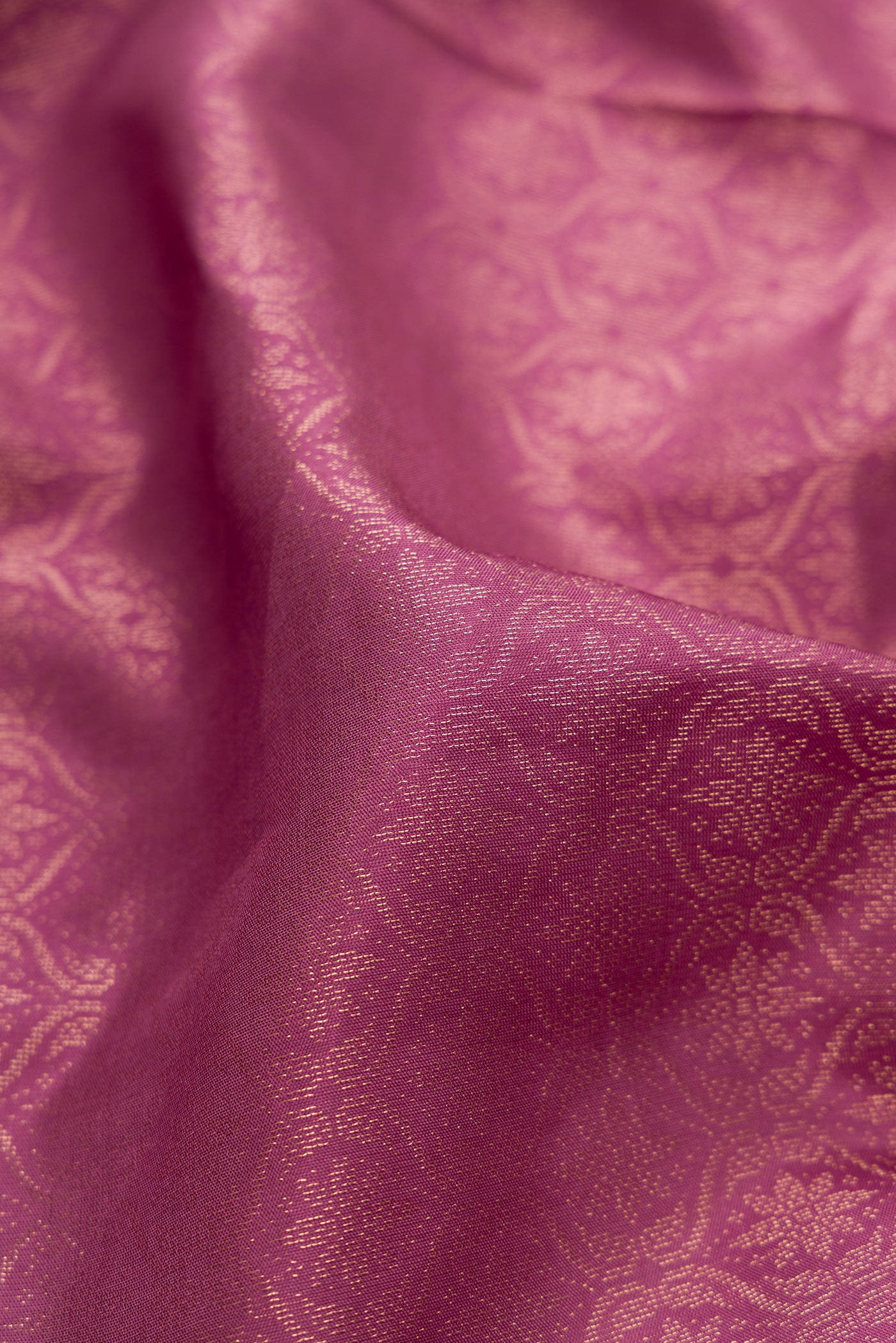 Close up of Lavender Soft Silk Saree with Zari Brocade on the body and Fancy Border.  displaying folds
