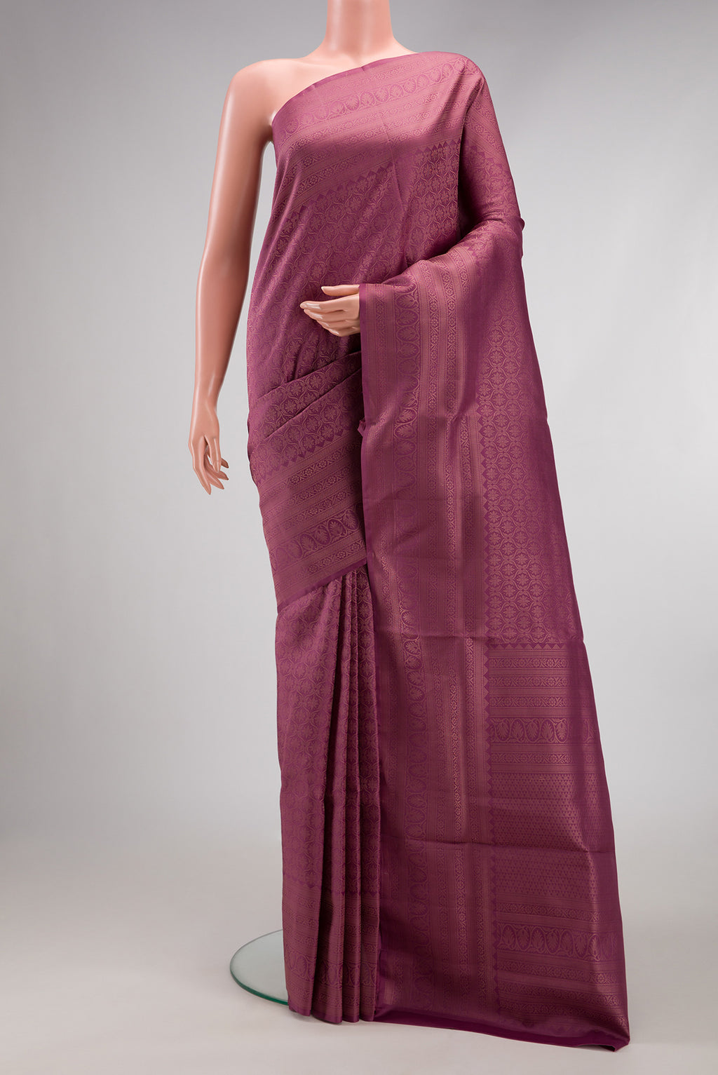 Lavender Soft Silk Saree with Zari Brocade on the body and Fancy Border.  displayed on a mannequin
