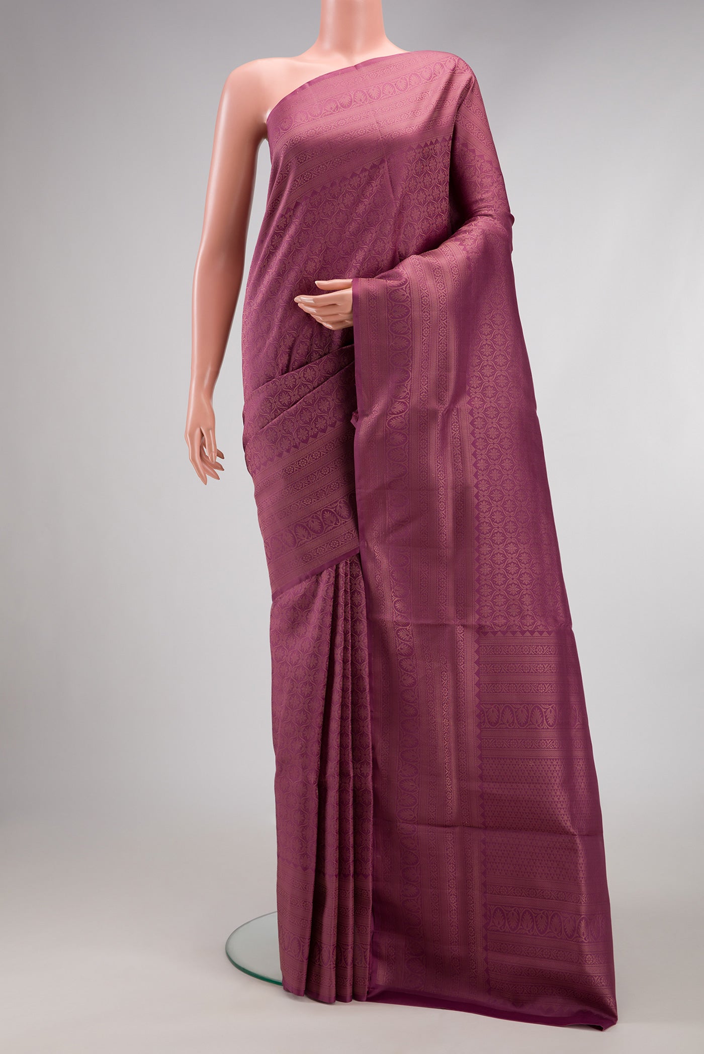Lavender Soft Silk Saree with Zari Brocade on the body and Fancy Border.  displayed on a mannequin