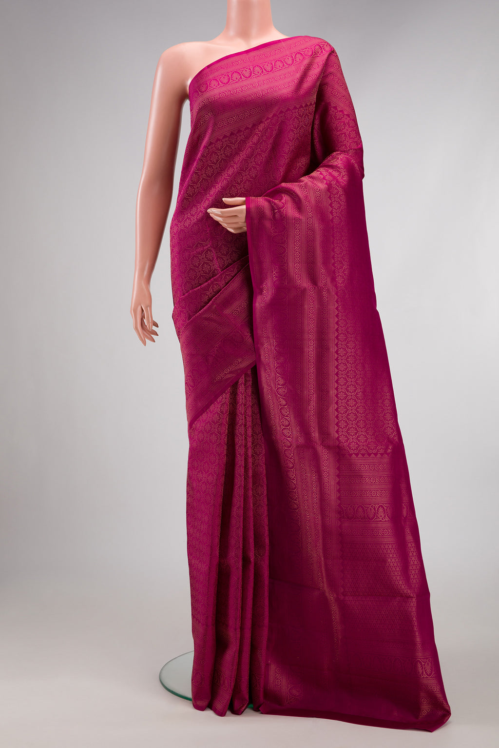 Magenta Soft Silk Saree with Zari Brocade on the body and Fancy Border.  displayed on a mannequin