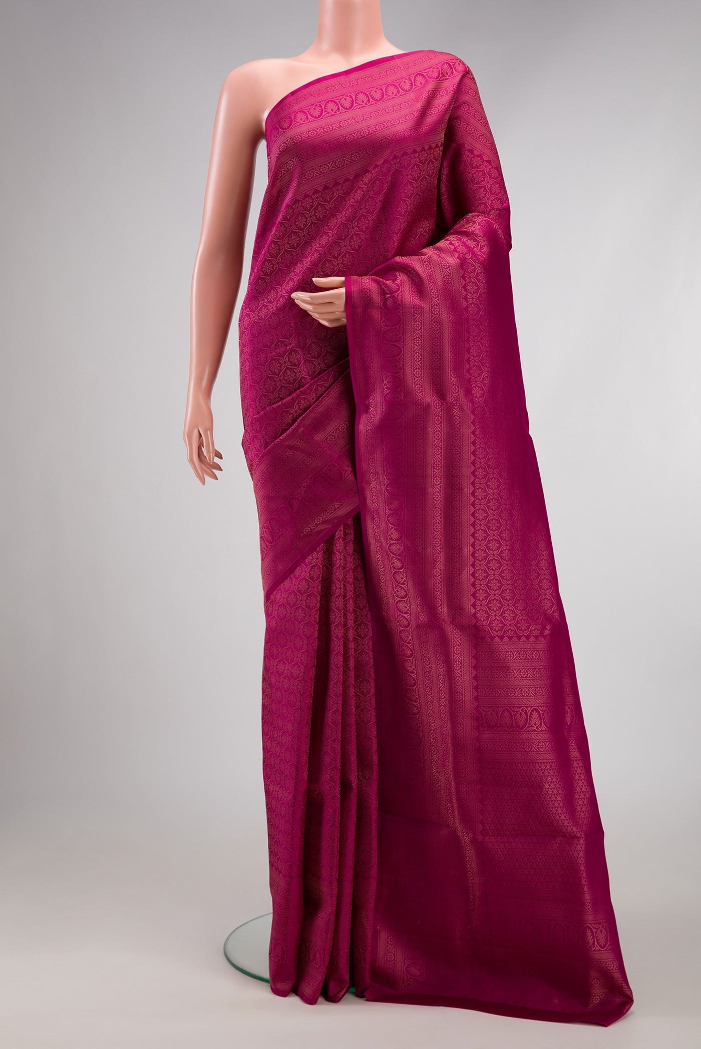 Magenta Soft Silk Saree with Zari Brocade on the body and Fancy Border.  displayed on a mannequin