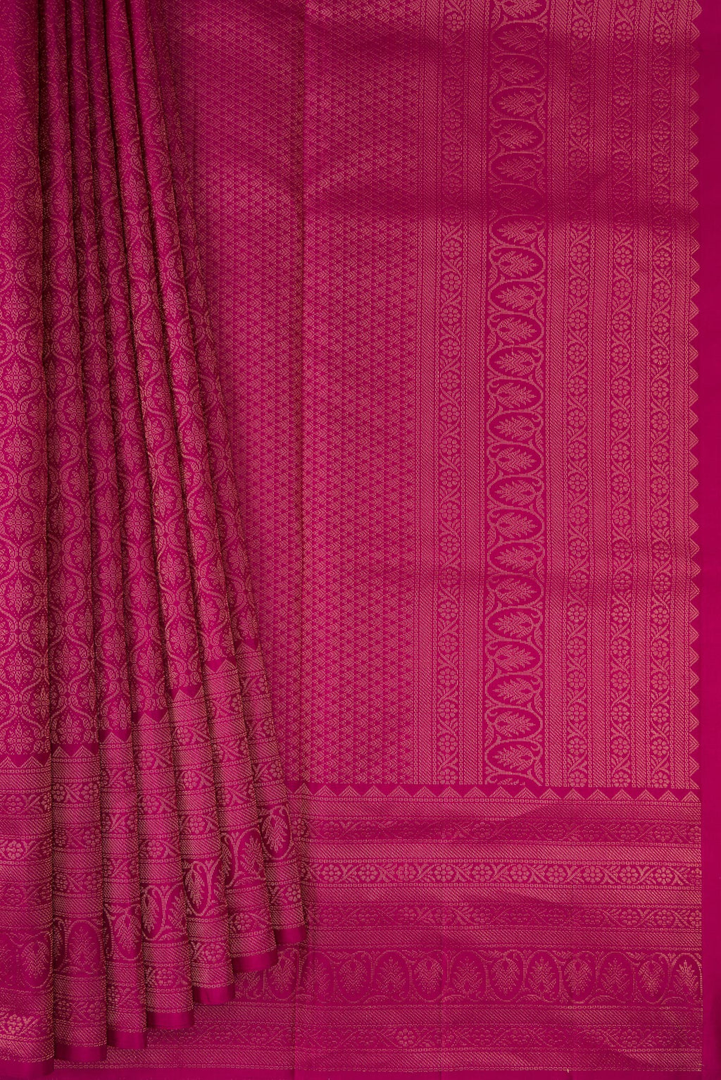 Pleats and pallu of Magenta Soft Silk Saree with Zari Brocade on the body and Fancy Border. 