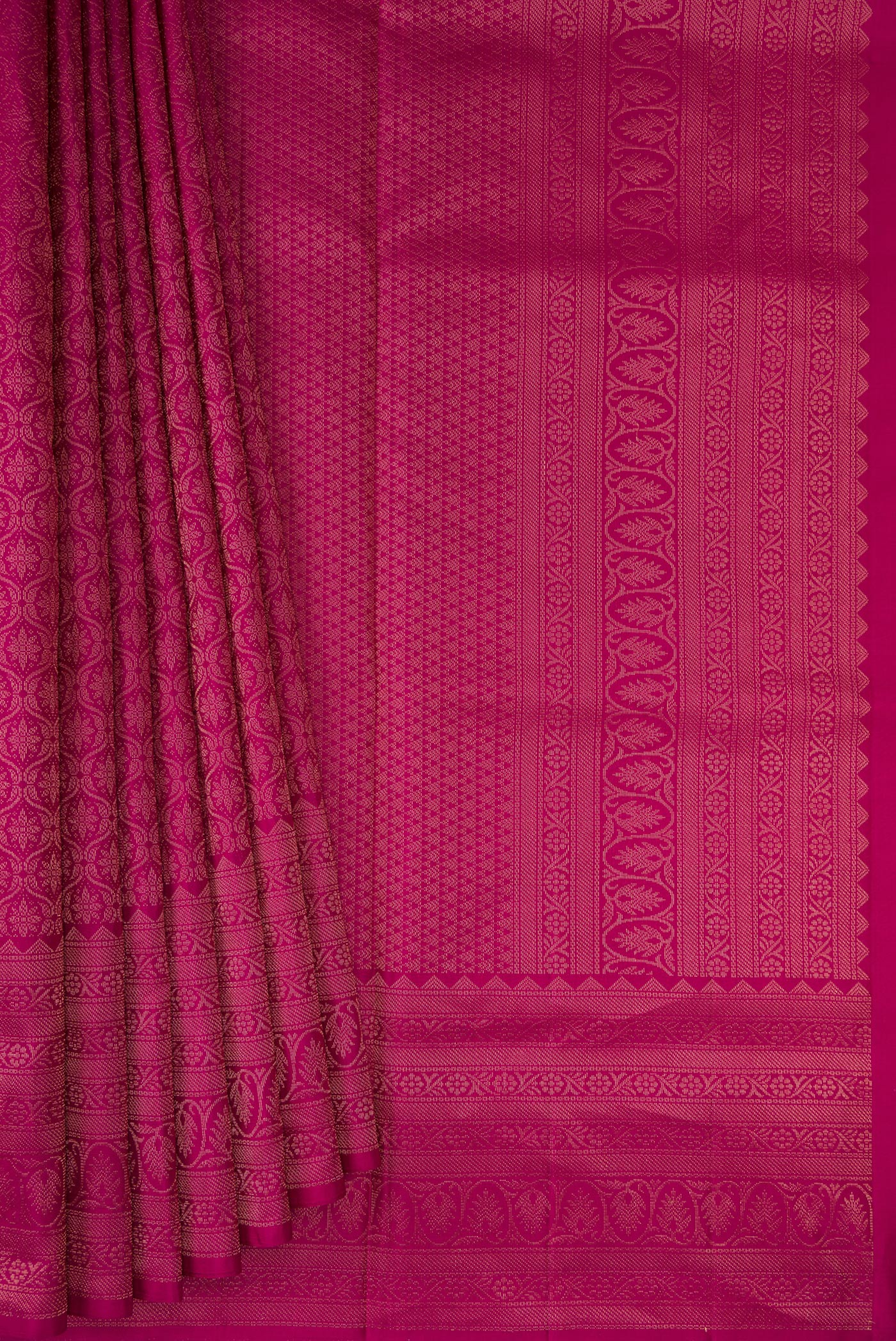 Pleats and pallu of Magenta Soft Silk Saree with Zari Brocade on the body and Fancy Border. 