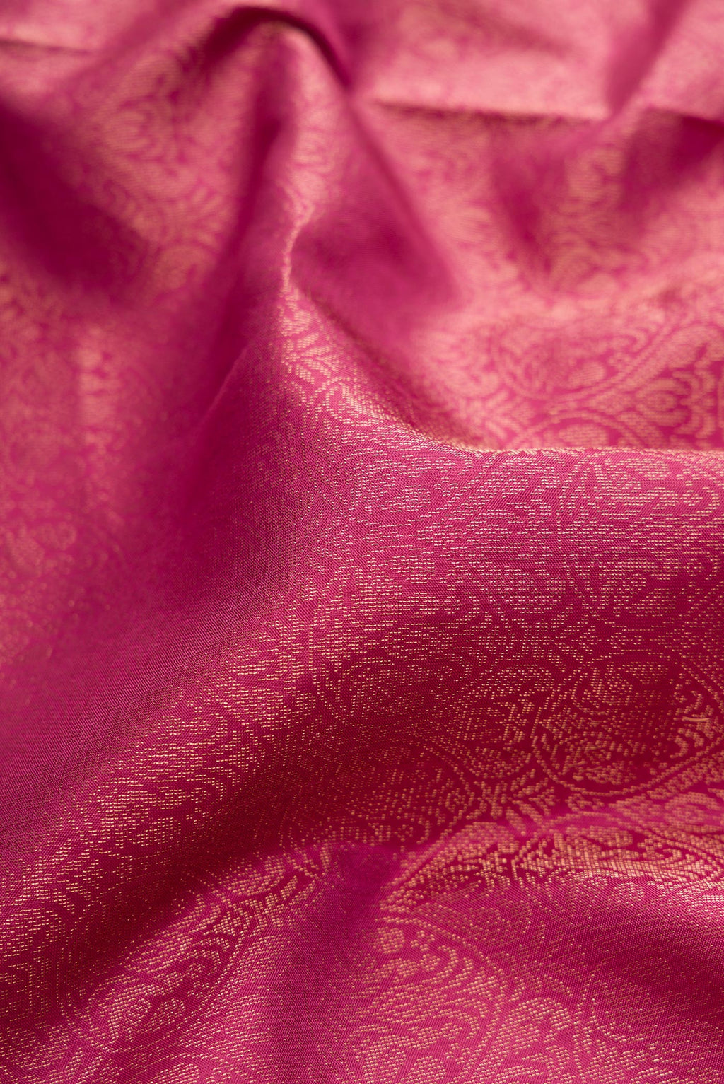 Close up of Dark Pink Soft Silk Saree with Zari Brocade on the body and Fancy Border.  displaying folds