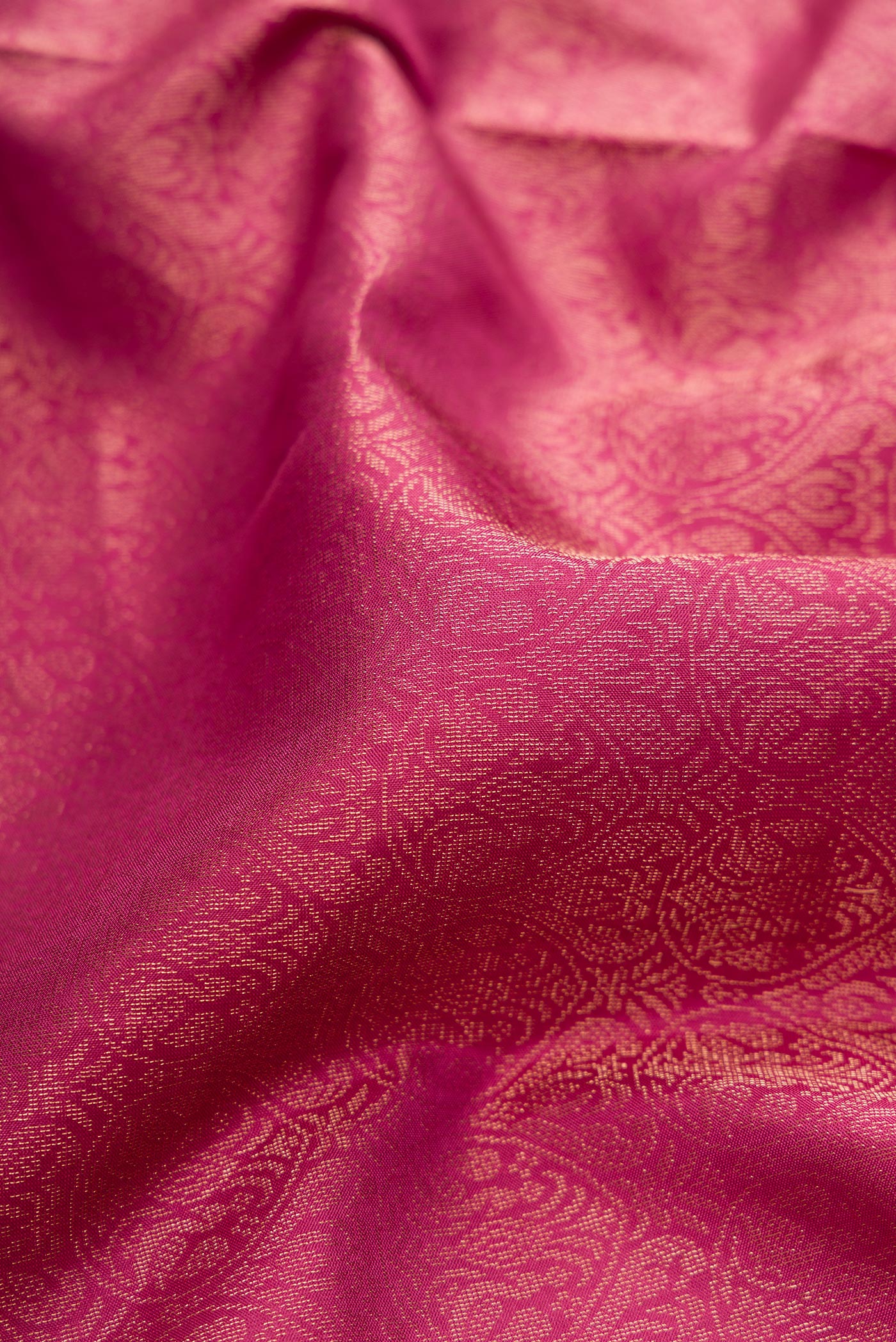 Close up of Dark Pink Soft Silk Saree with Zari Brocade on the body and Fancy Border.  displaying folds