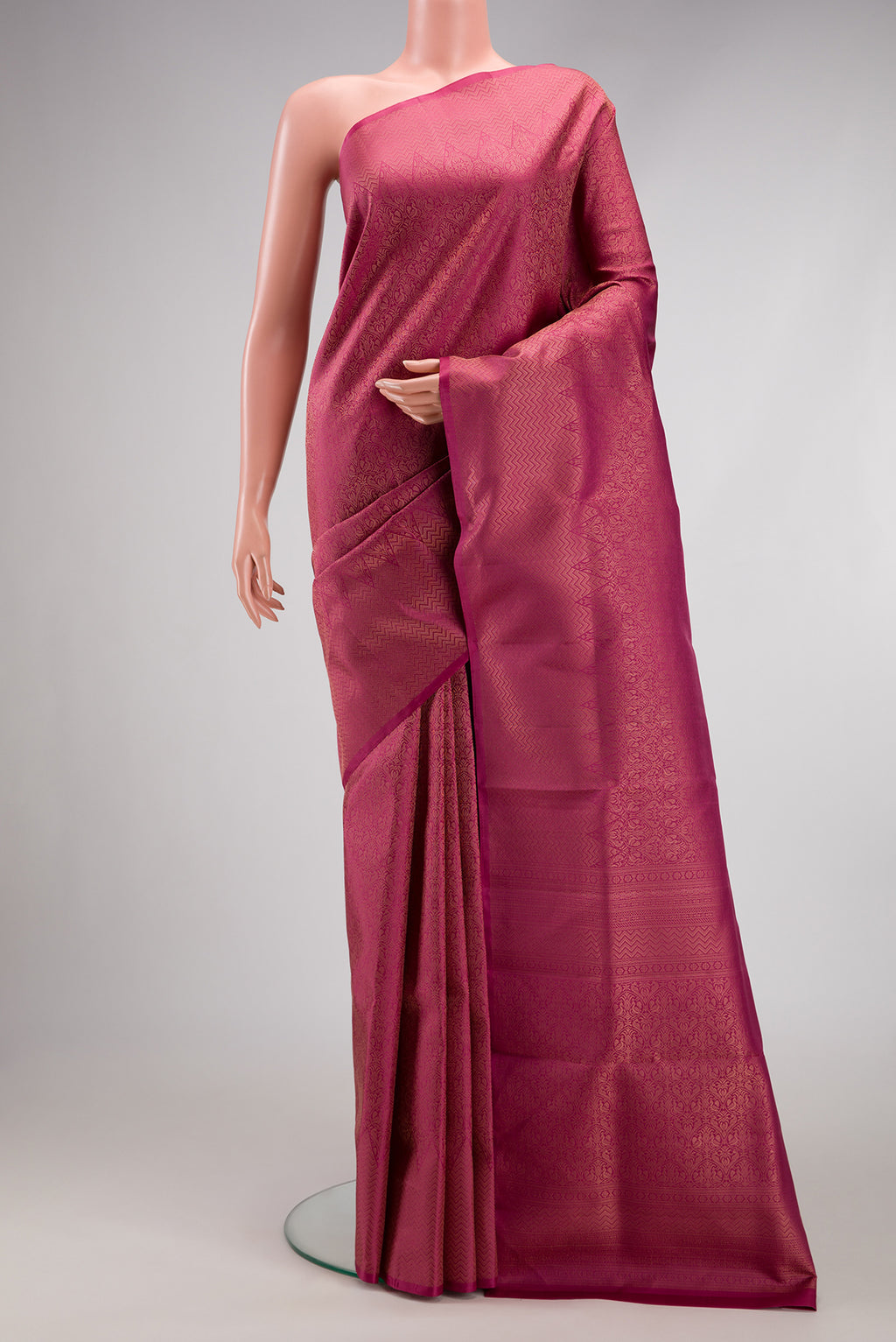 Dark Pink Soft Silk Saree with Zari Brocade on the body and Fancy Border.  displayed on a mannequin