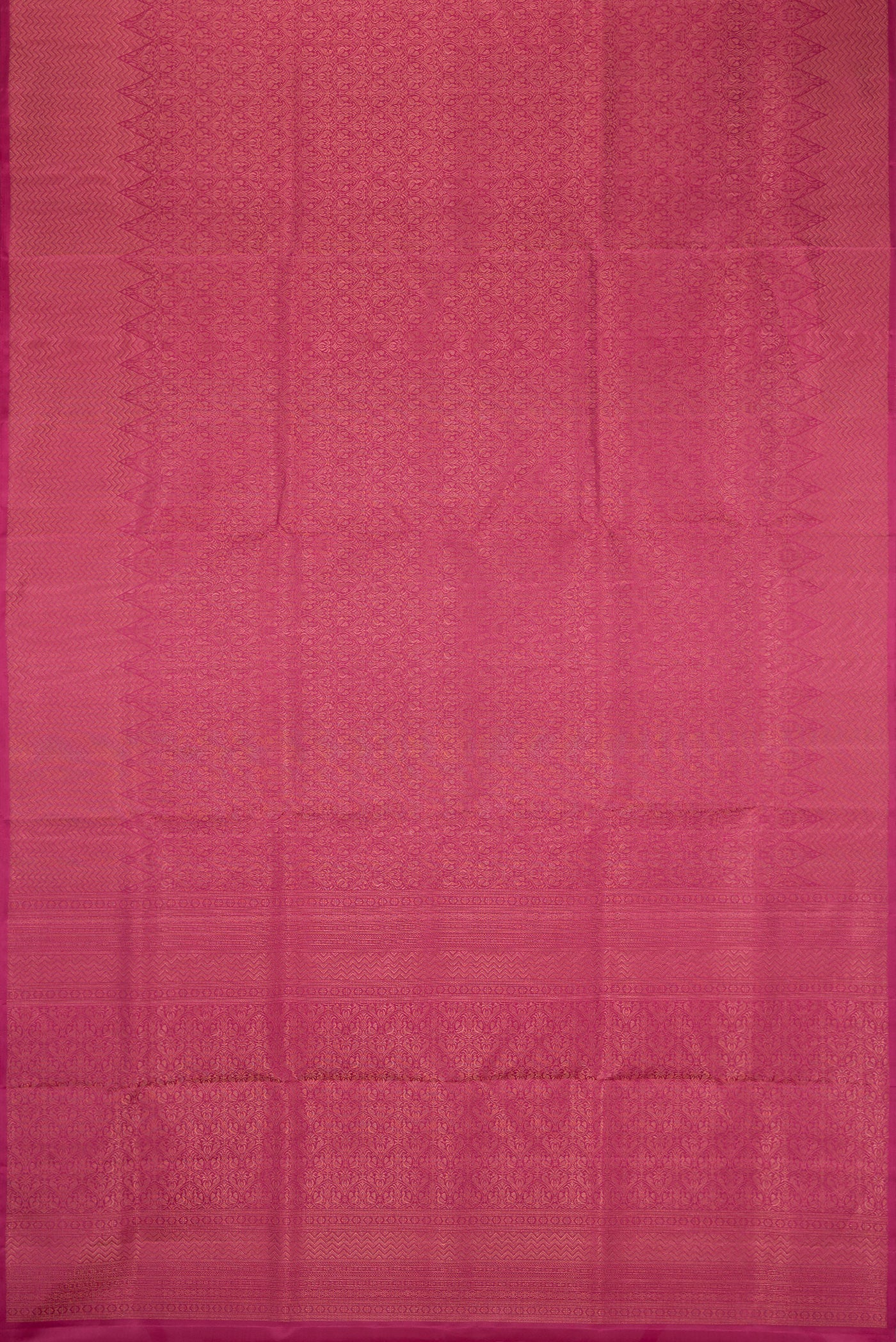 Flat view of Dark Pink Soft Silk Saree with Zari Brocade on the body and Fancy Border. 