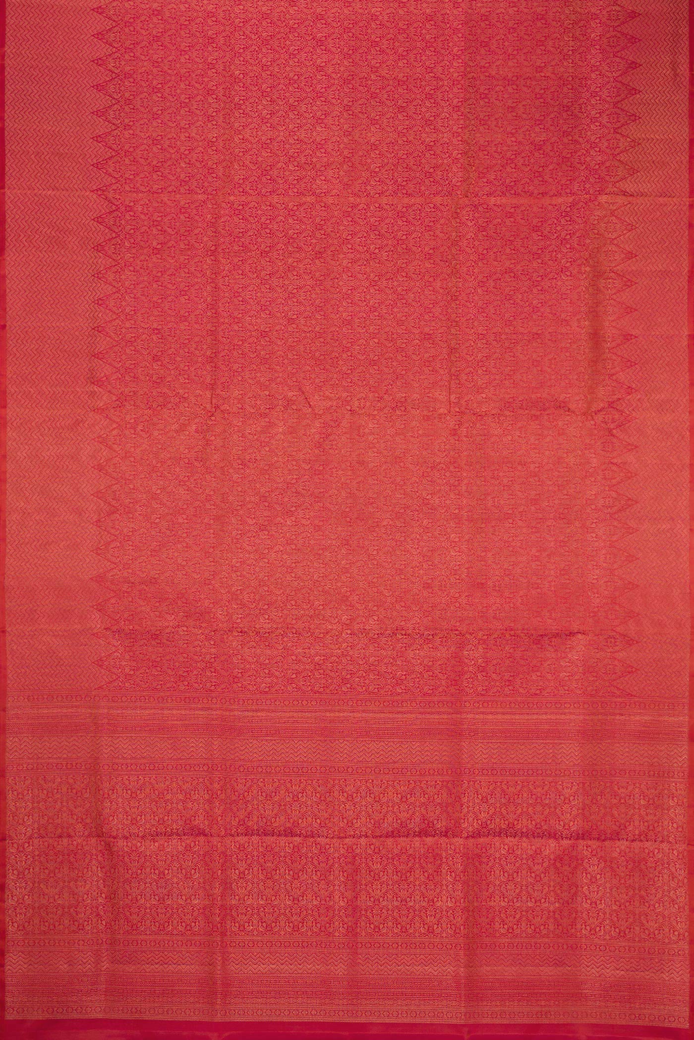 Flat view of Coral Soft Silk Saree with Zari Brocade on the body and Fancy Border. 