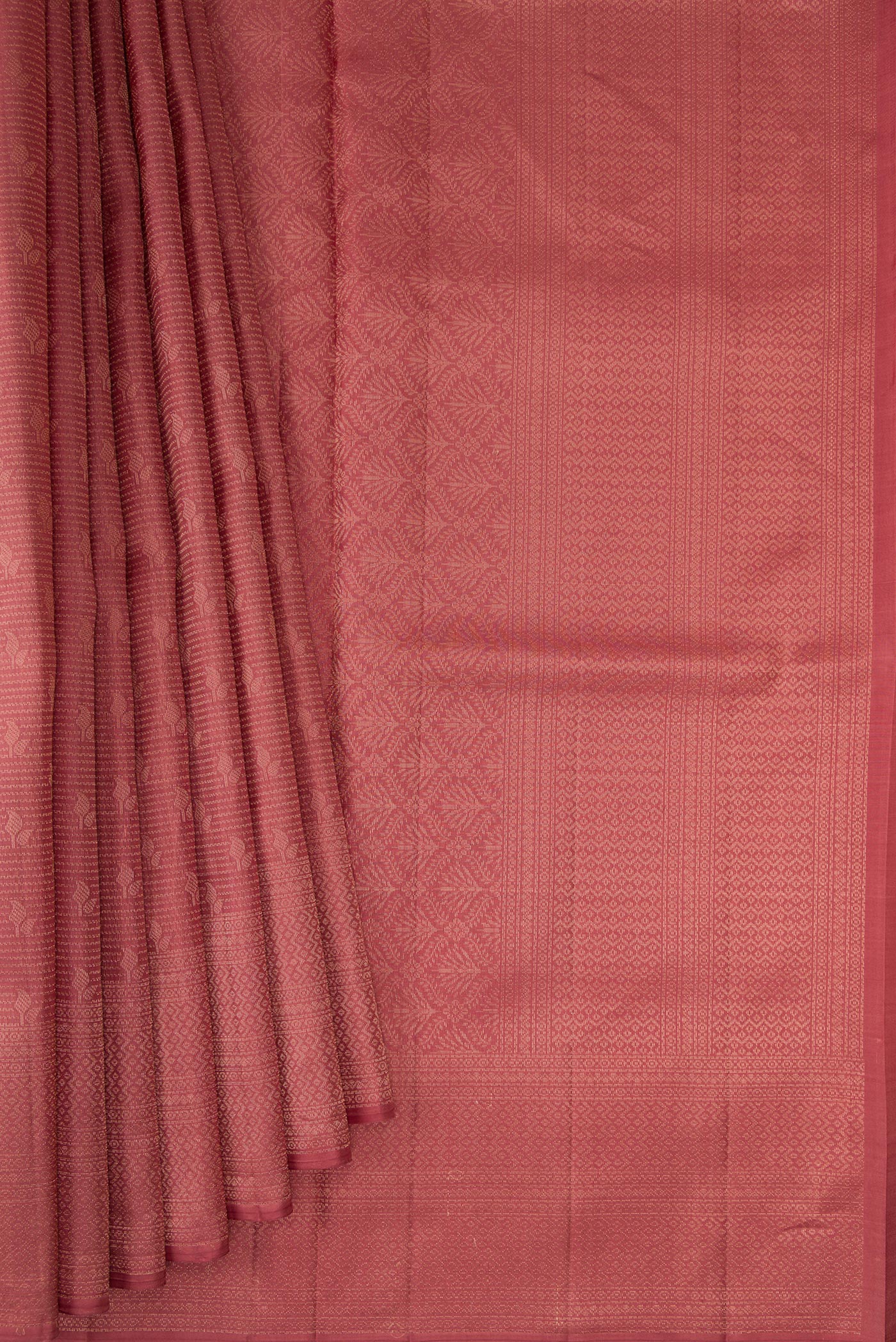 Pleats and pallu of Rose Gold Soft Silk Saree with Zari Brocade on the body and Fancy Border. 