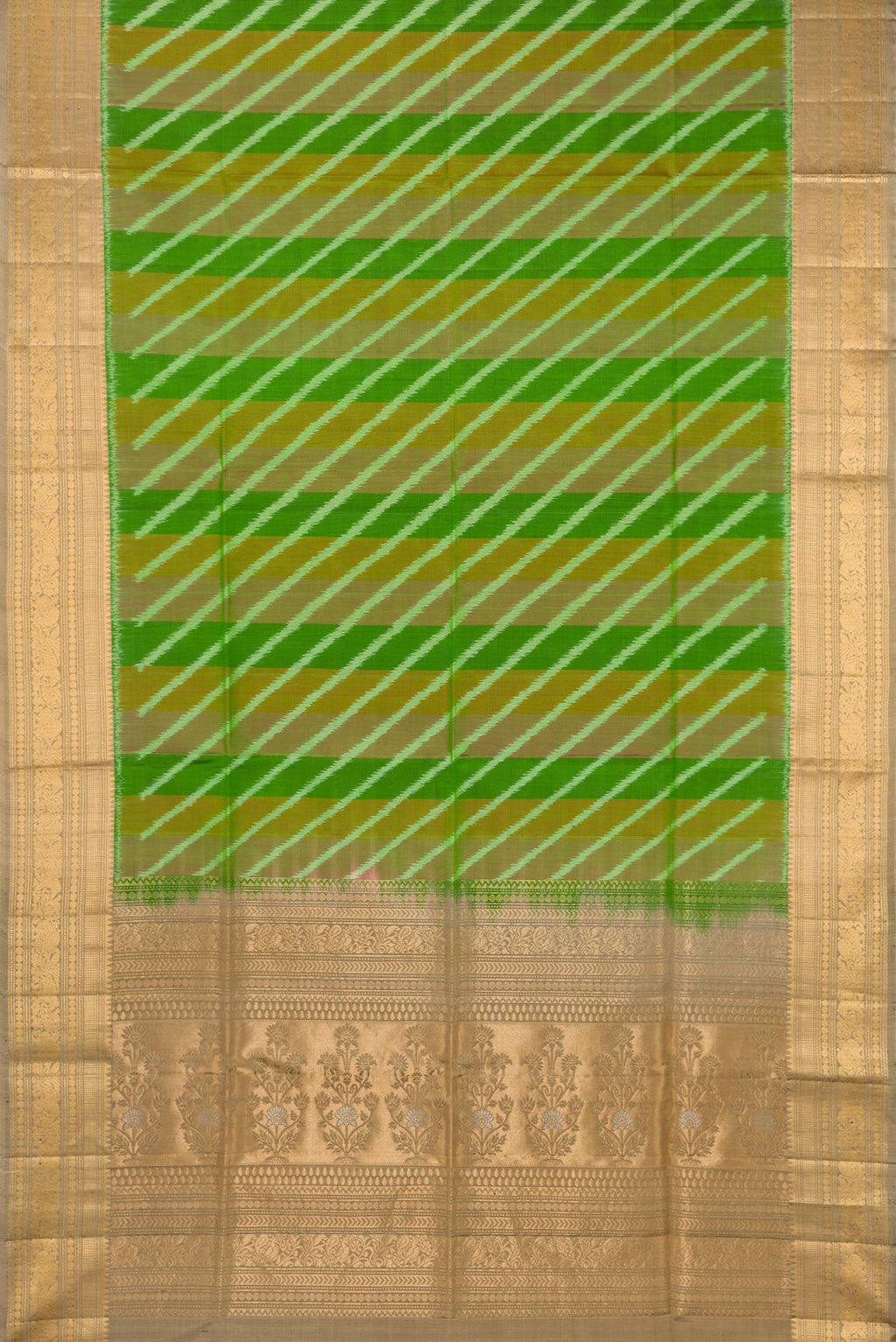 Flat view of Green Soft Silk Saree with Ikat design on the body and Zari Border. 