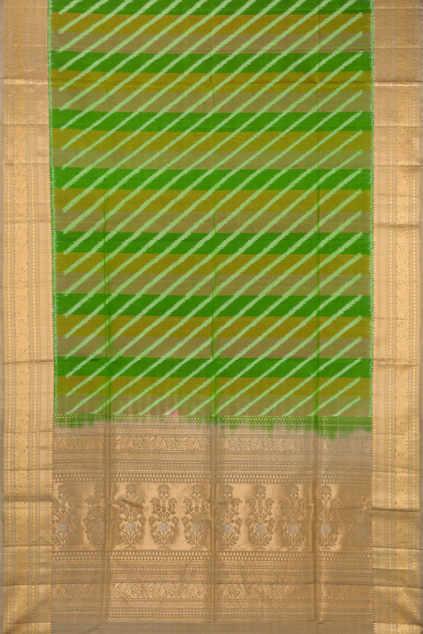 Flat view of Green Soft Silk Saree with Ikat design on the body and Zari Border. 