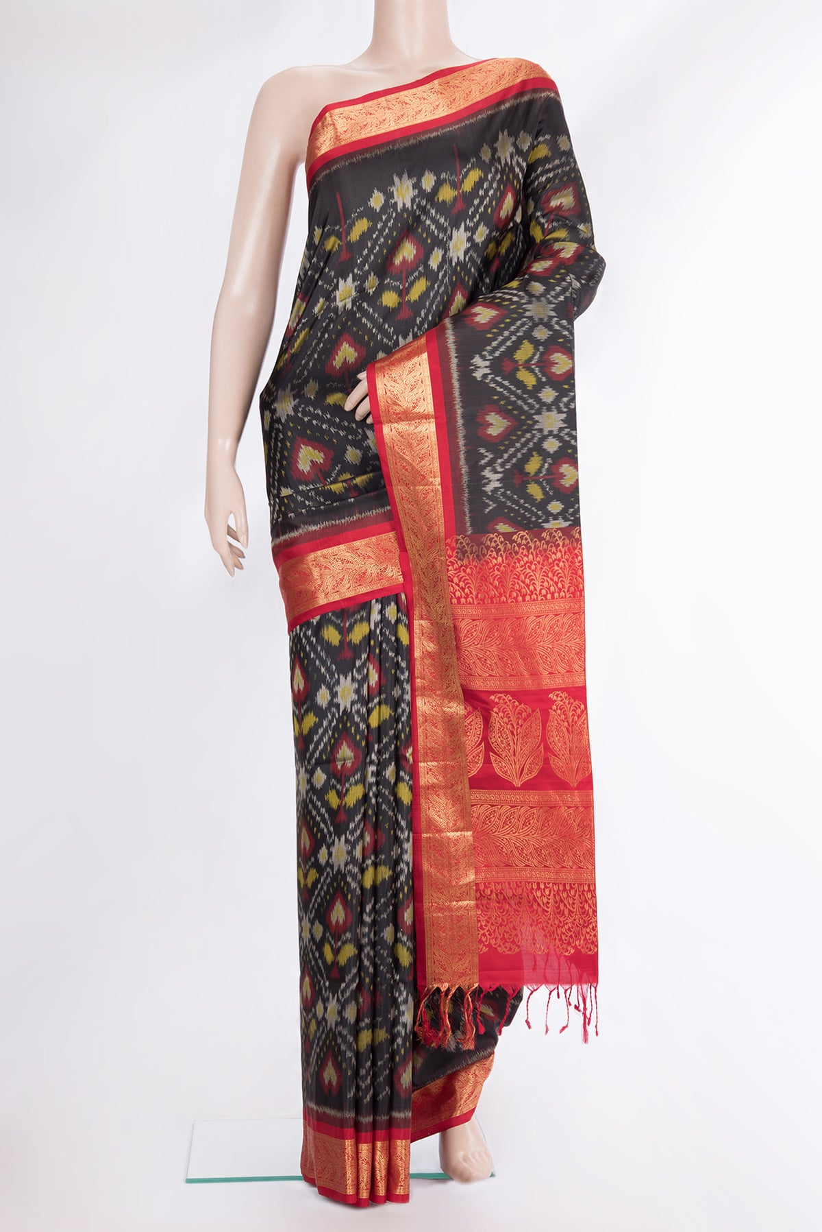Pure Silk Black Dual Tone Soft Saree with Ikat Print on the body and Zari Border.  displayed on a mannequin