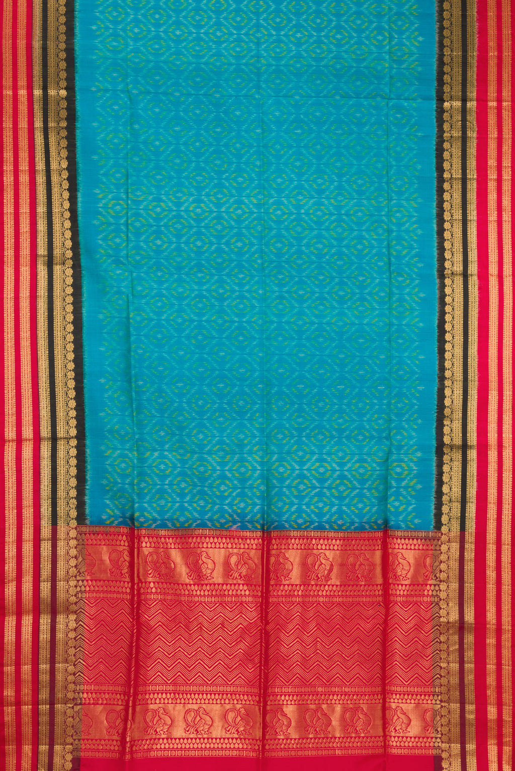 Flat view of Sky Blue Soft Silk Saree with Ikat Print on the body and Fancy Border. 