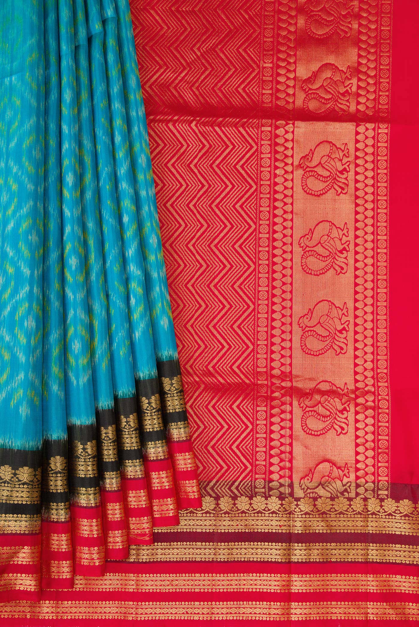 Pleats and pallu of Sky Blue Soft Silk Saree with Ikat Print on the body and Fancy Border. 