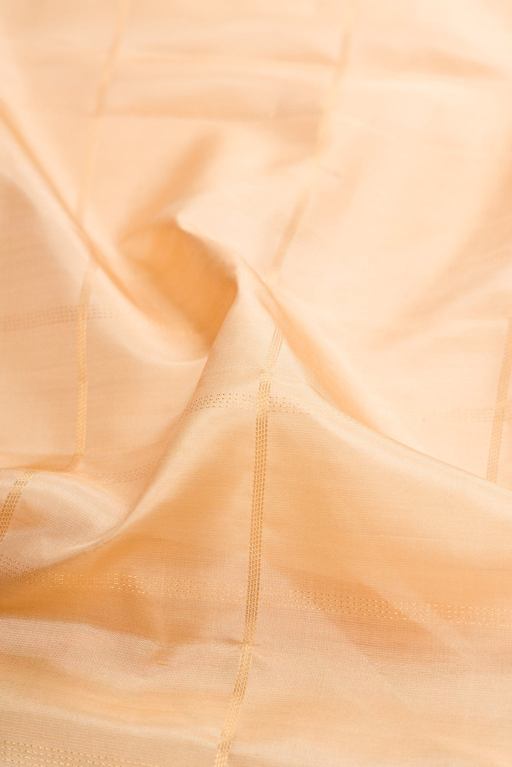 Close up of Sandal Soft Silk Saree with Checked design on the body and Ikat Border.  displaying folds
