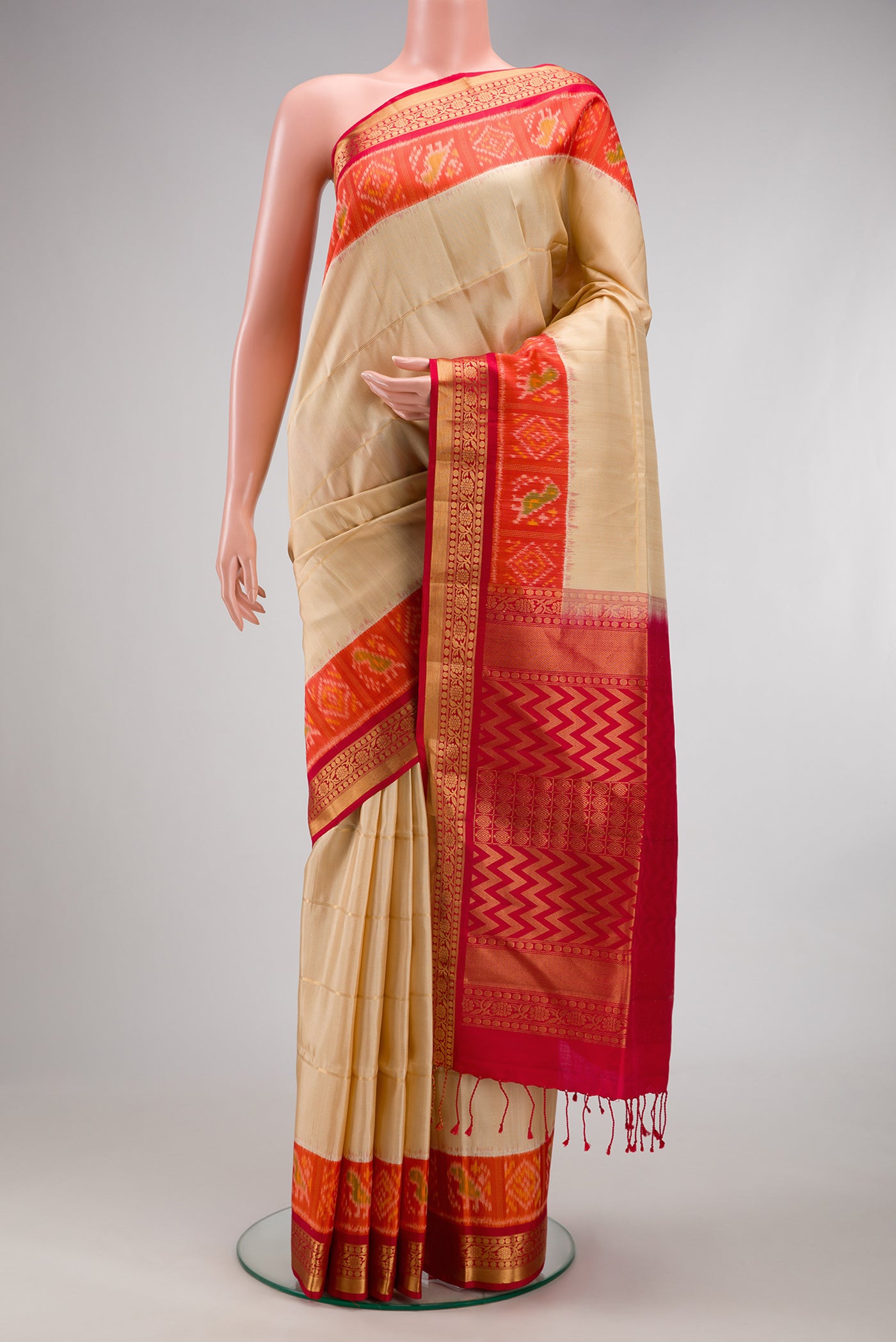 Sandal Soft Silk Saree with Checked design on the body and Ikat Border.  displayed on a mannequin