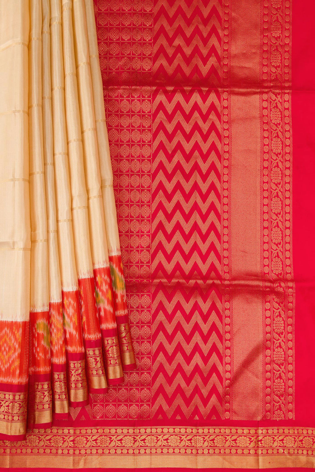 Pleats and pallu of Sandal Soft Silk Saree with Checked design on the body and Ikat Border. 