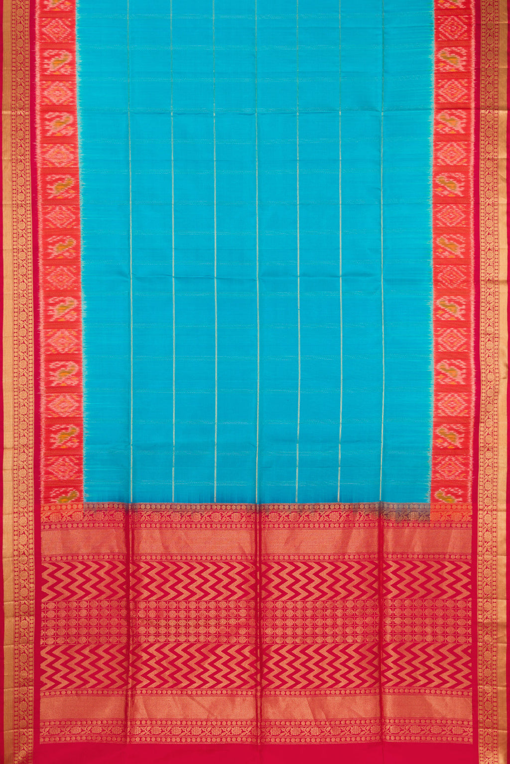 Flat view of Sky Blue Soft Silk Saree with Checked design on the body and Ikat Border. 