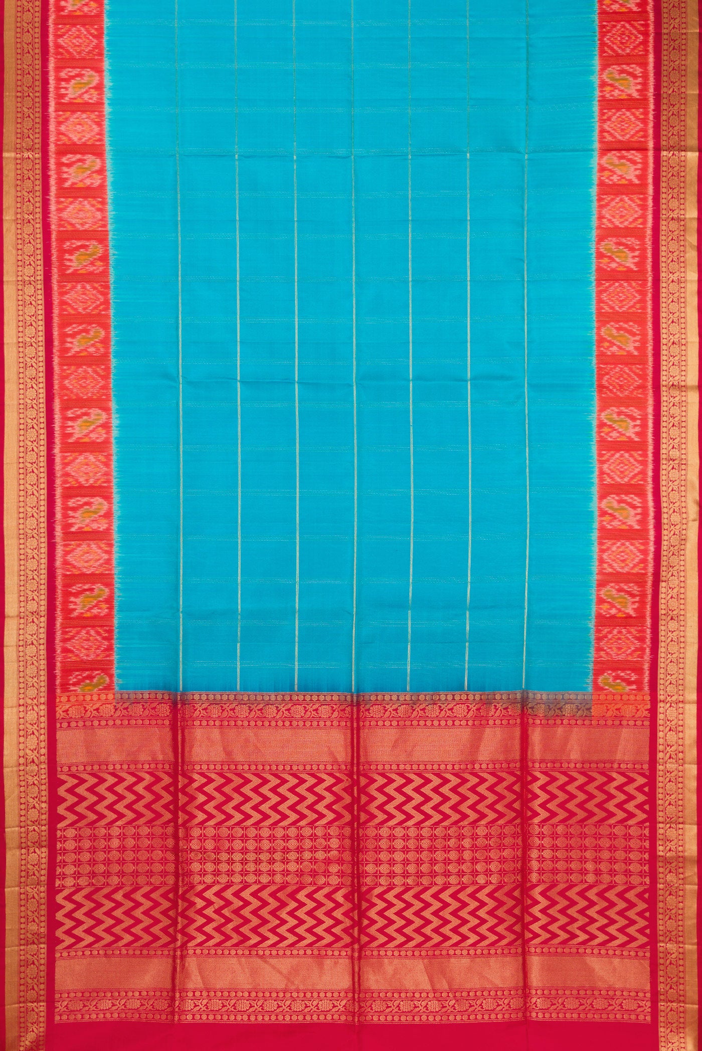 Flat view of Sky Blue Soft Silk Saree with Checked design on the body and Ikat Border. 