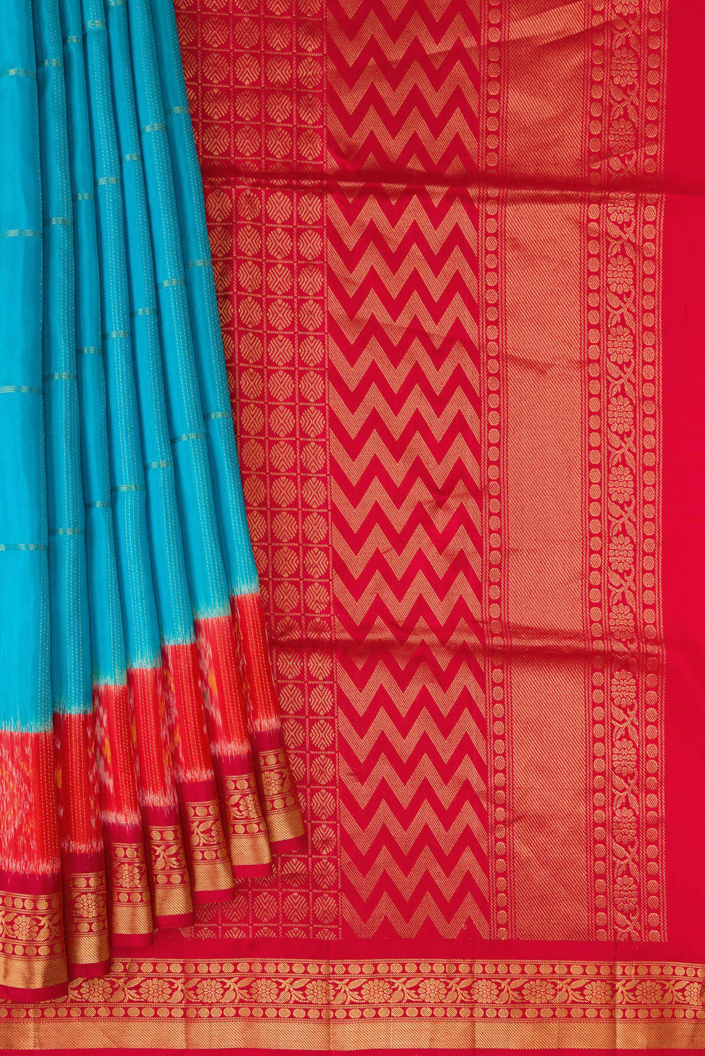 Pleats and pallu of Sky Blue Soft Silk Saree with Checked design on the body and Ikat Border. 