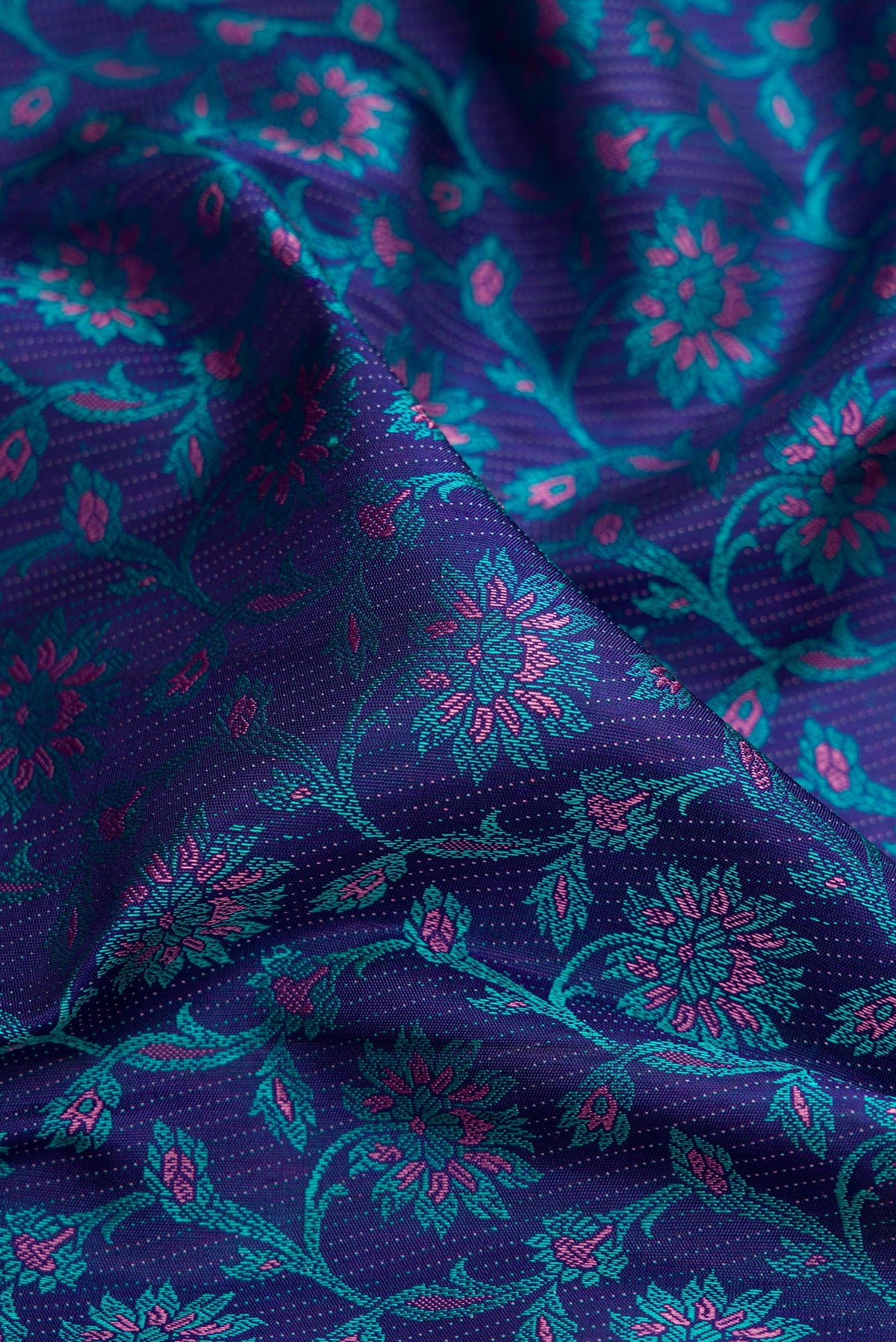 Close up of Navy Blue Kanchipuram Silk Saree with Jacquard design on the body and Fancy Border.  displaying folds