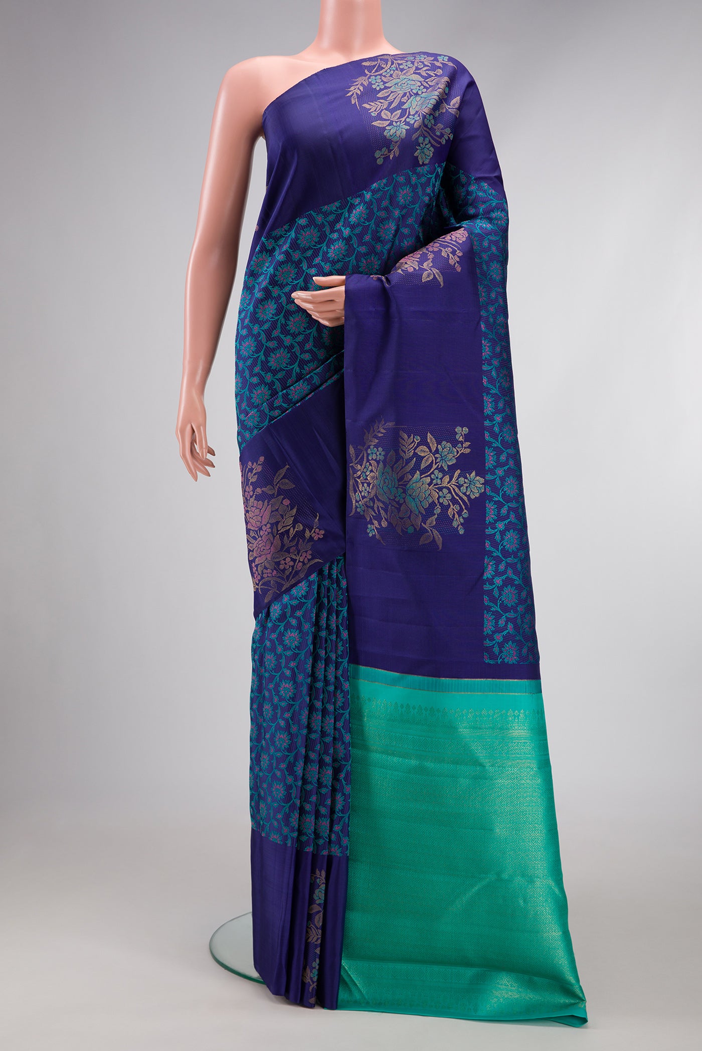 Navy Blue Kanchipuram Silk Saree with Jacquard design on the body and Fancy Border.  displayed on a mannequin