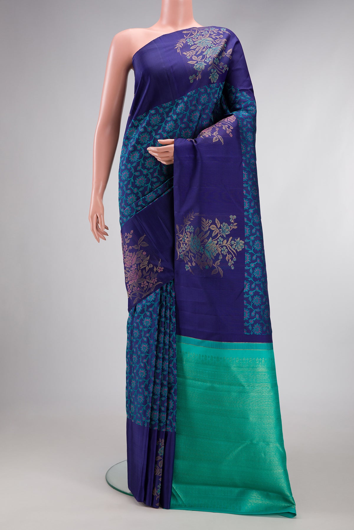Navy Blue Kanchipuram Silk Saree with Jacquard design on the body and Fancy Border.  displayed on a mannequin