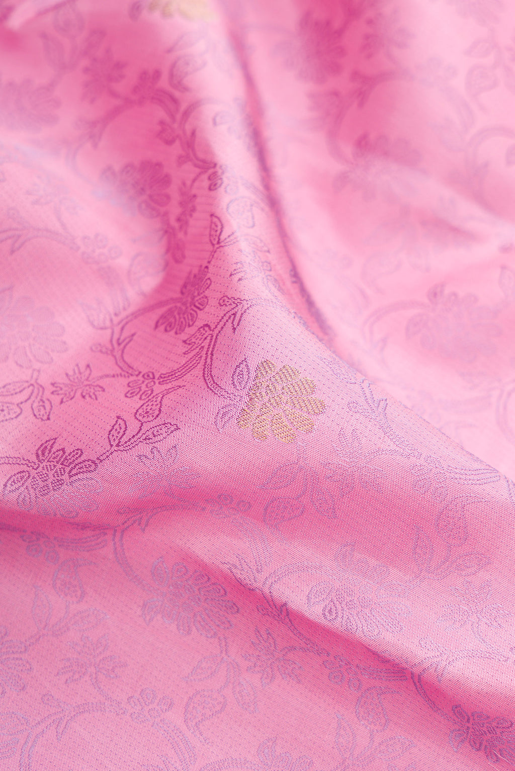 Close up of Pink Kanchipuram Silk Saree with Jacquard design on the body and Fancy Border.  displaying folds