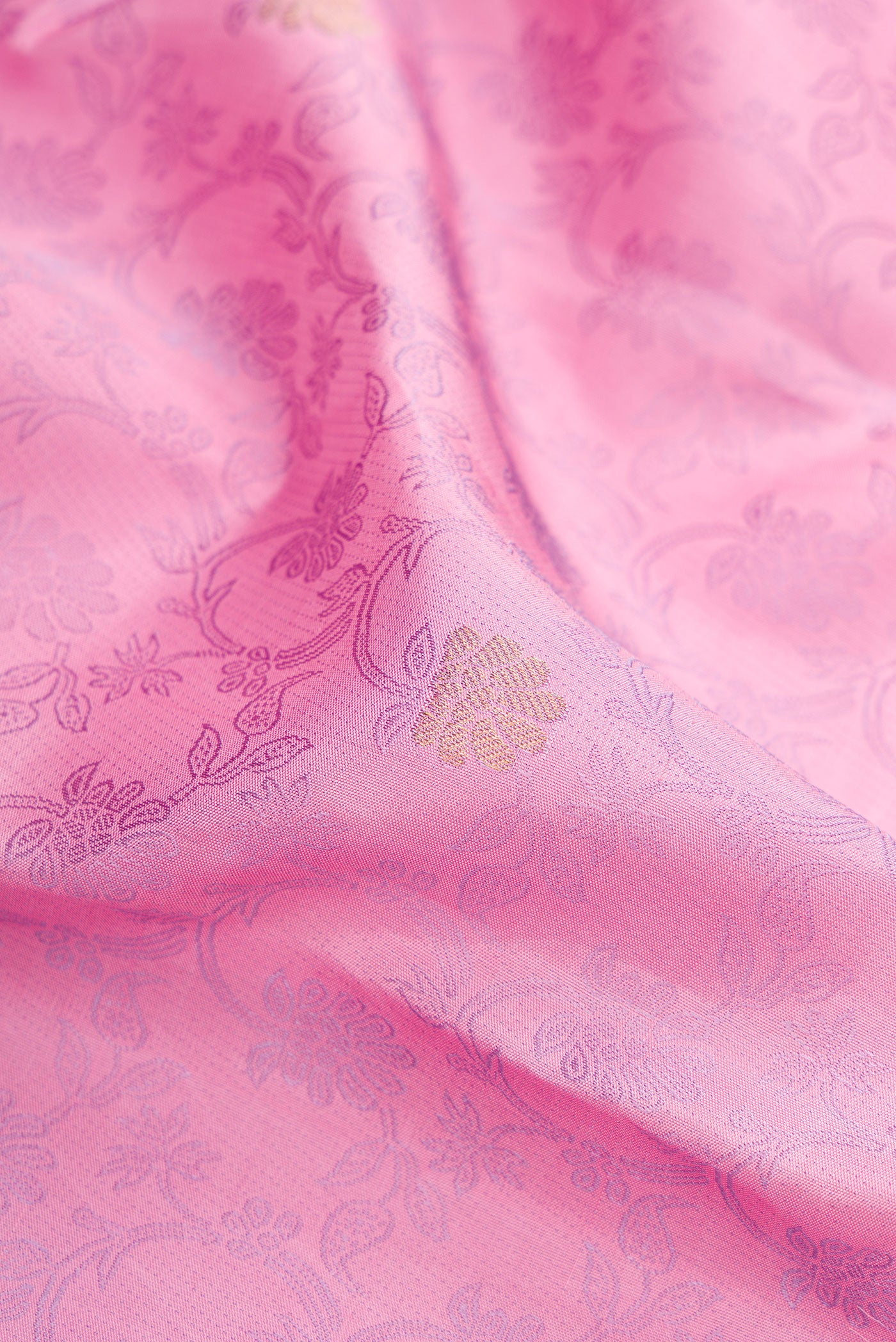 Close up of Pink Kanchipuram Silk Saree with Jacquard design on the body and Fancy Border.  displaying folds